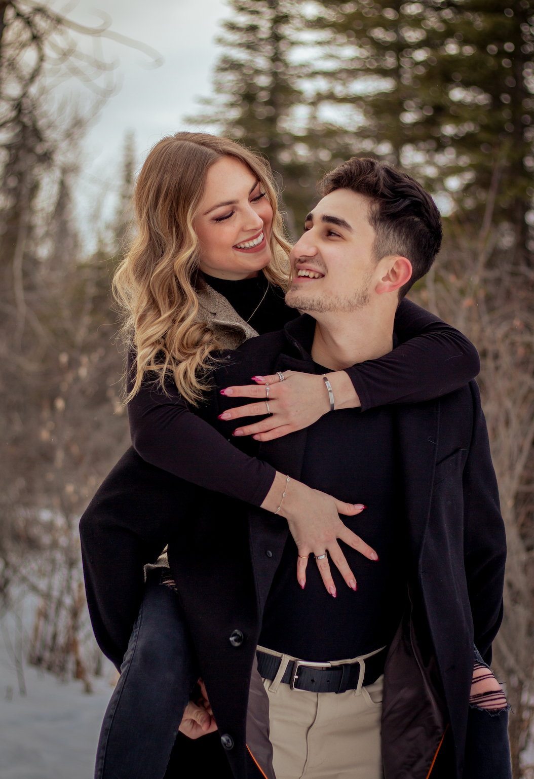Couple hugging smiling at eachother