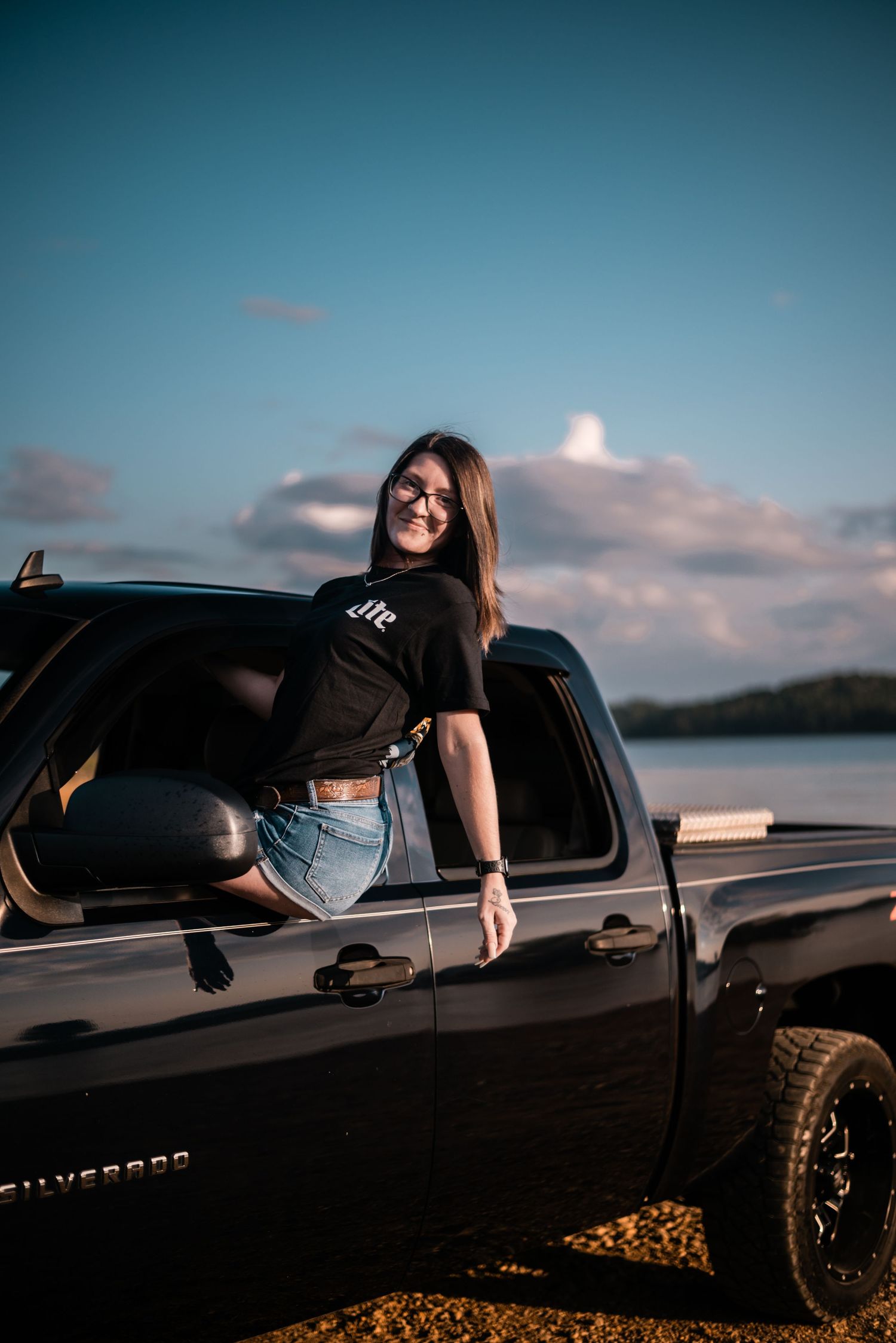 Stylish photo series featuring black pickup truck against sunset sky.