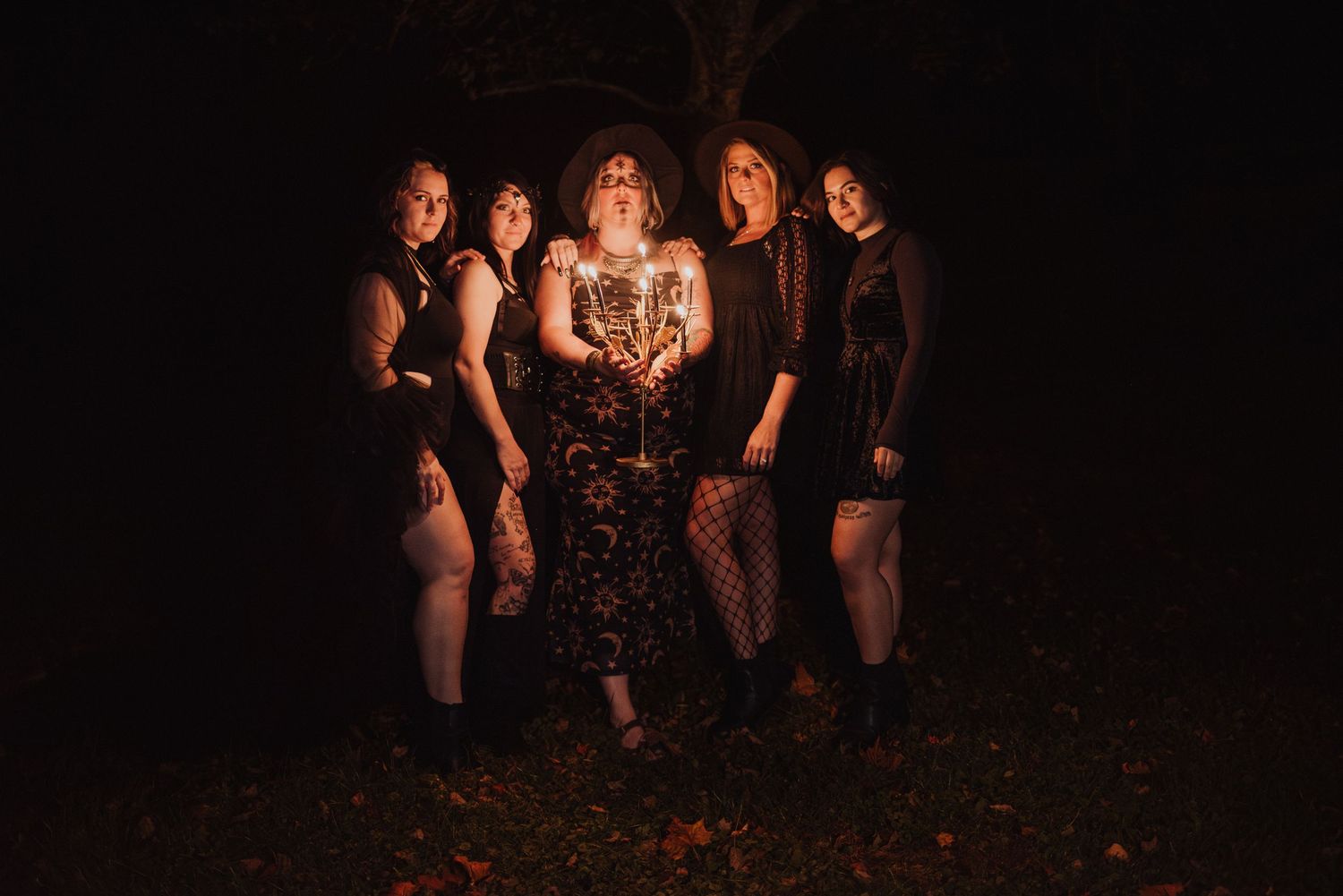 Group photo sequence at night with dramatic lighting effects.