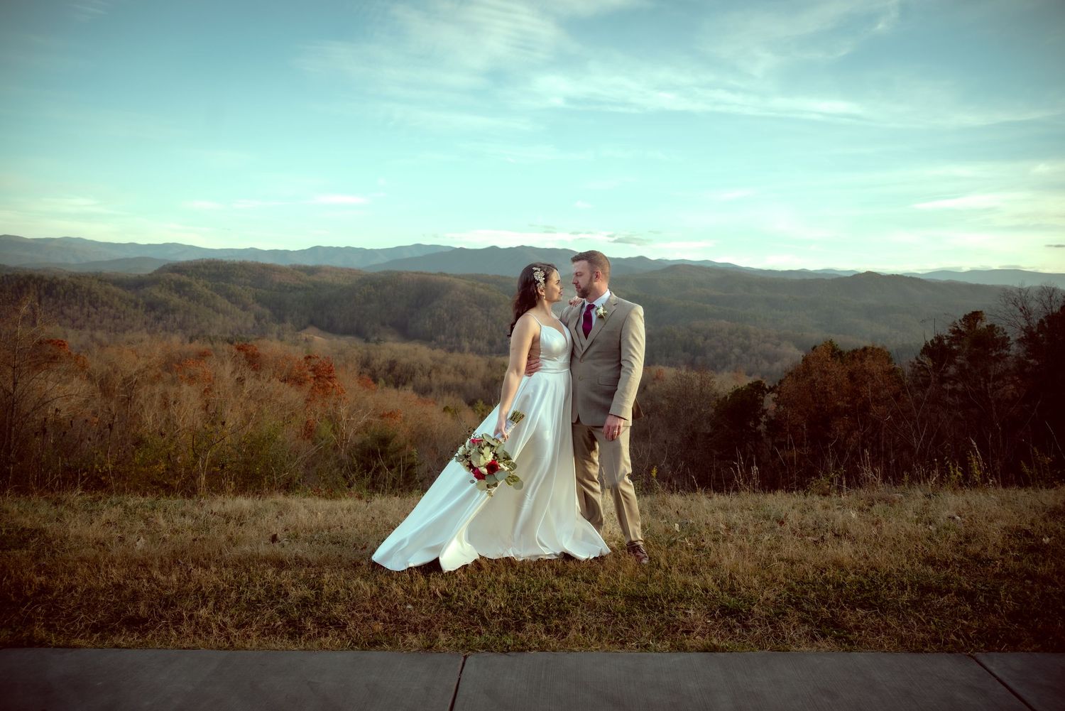 Panoramic wedding photos with mountain views and dramatic sky.