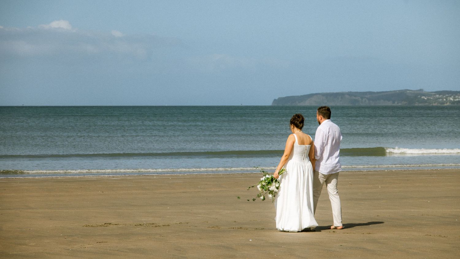 Series of beach wedding photos showing a couple walking along the shoreline at sunset.