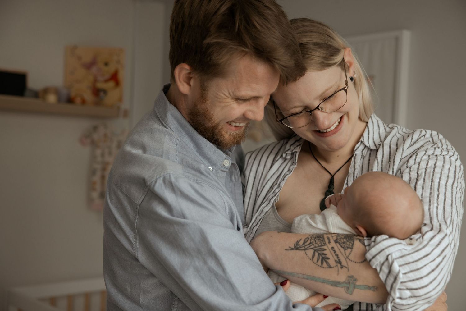 Tender indoor moments between family members in a softly lit room.