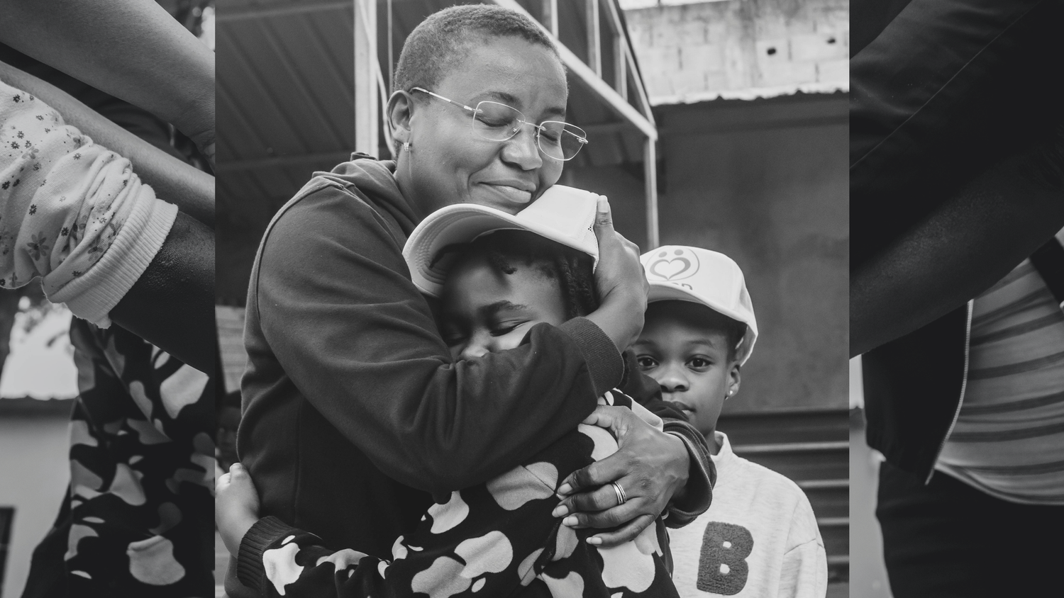 A black and white photo collage shows mother embracing and hugging kids.