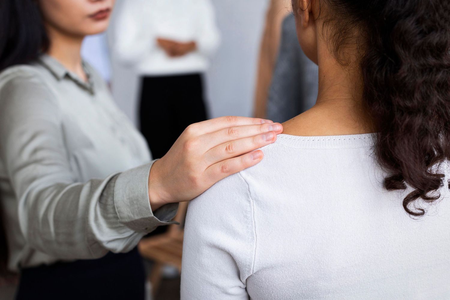 Counselor consoling client.