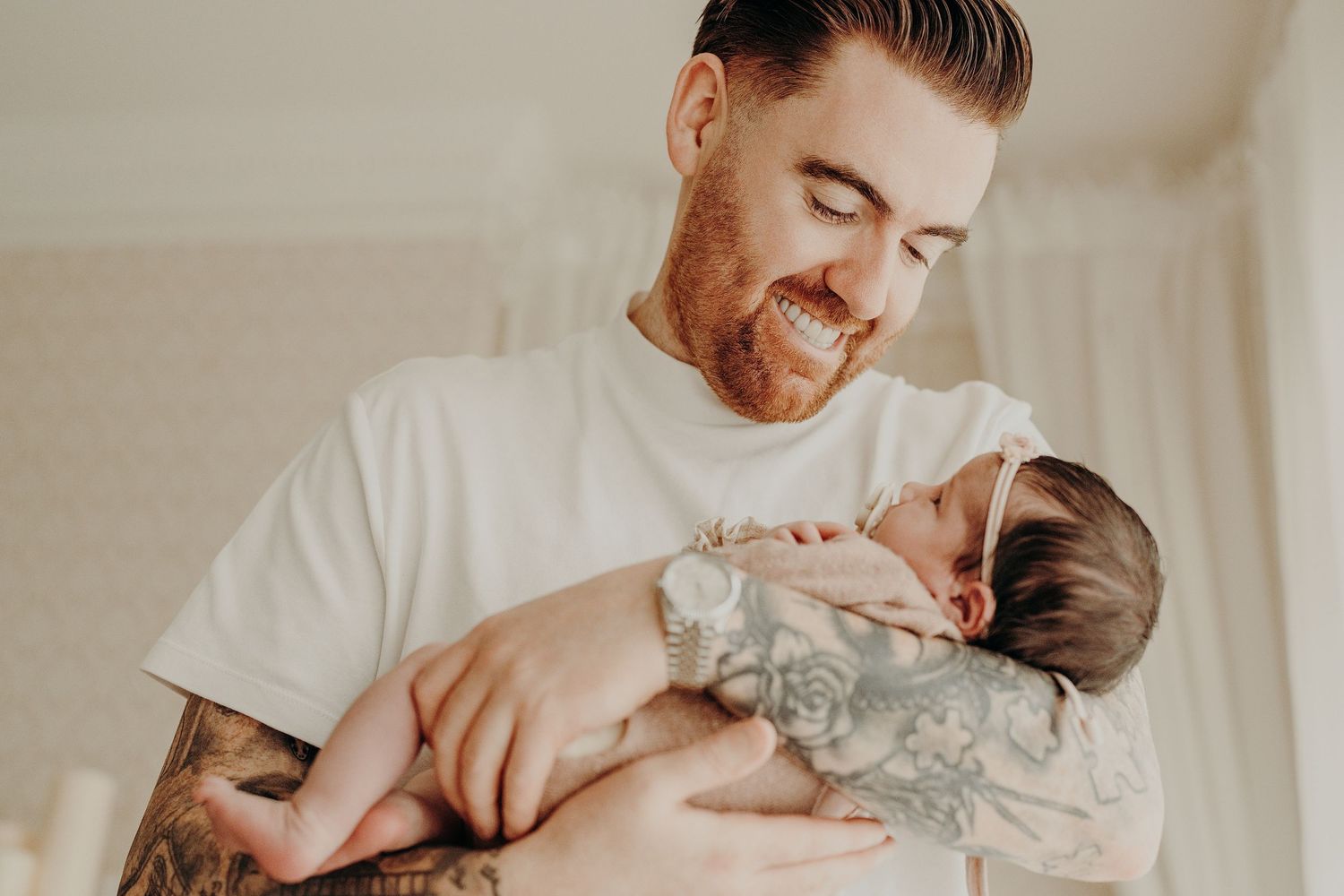 Candid family moments captured during an in-home newborn photography session.
