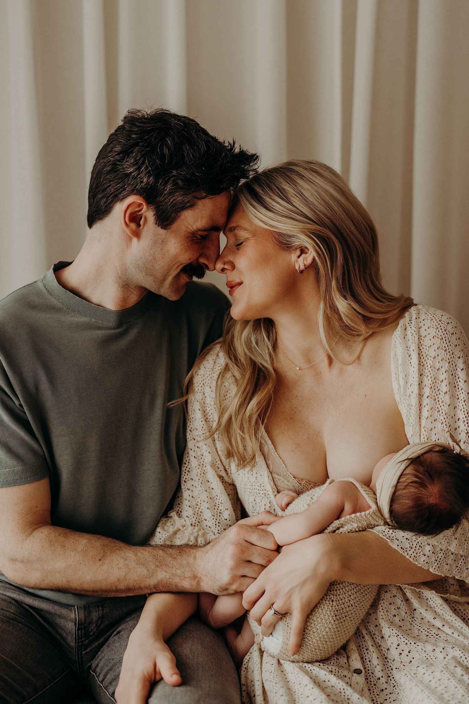Intimate family moment captured during in-home lifestyle photography session.