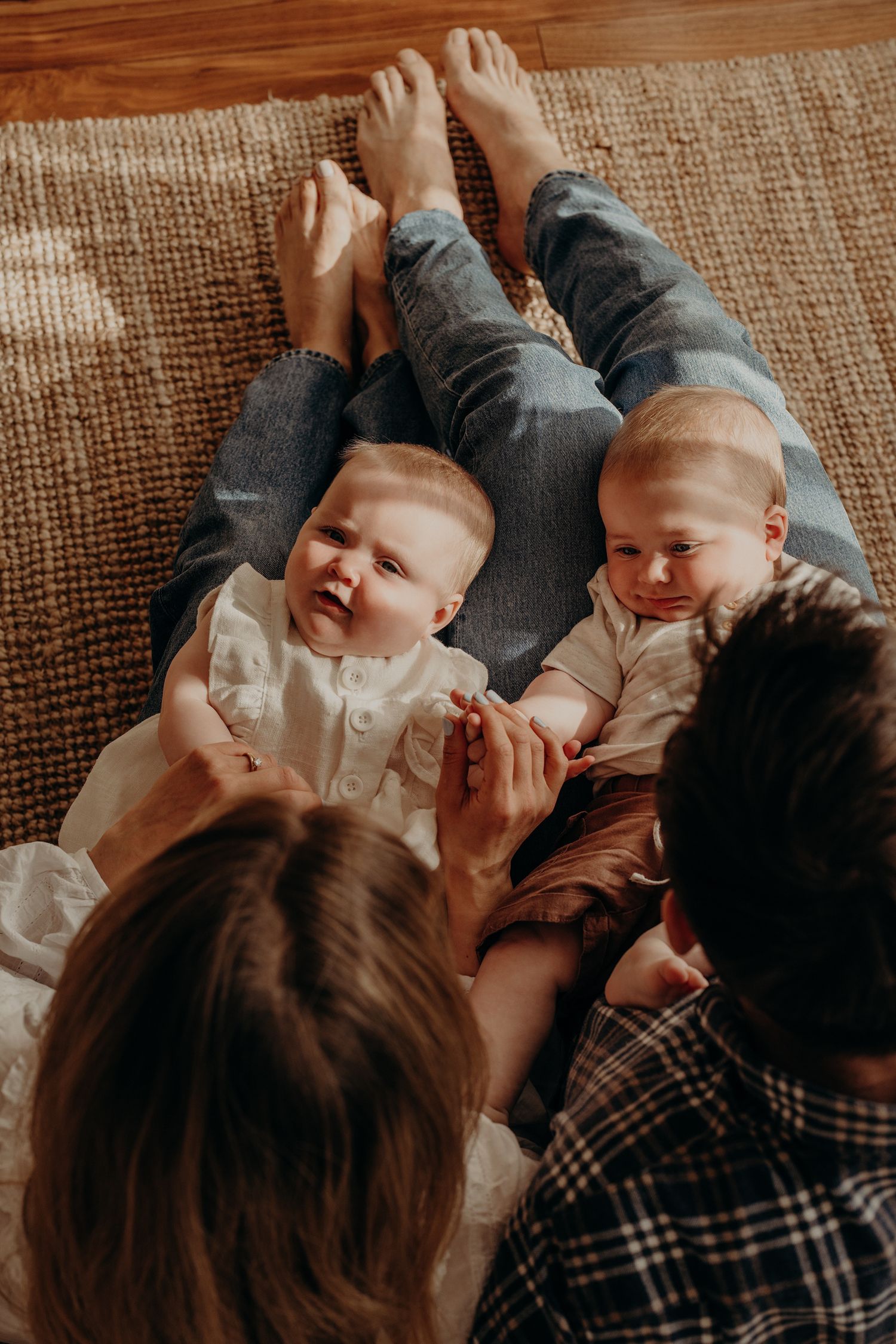 Family lying on couch sharing intimate moments with baby.