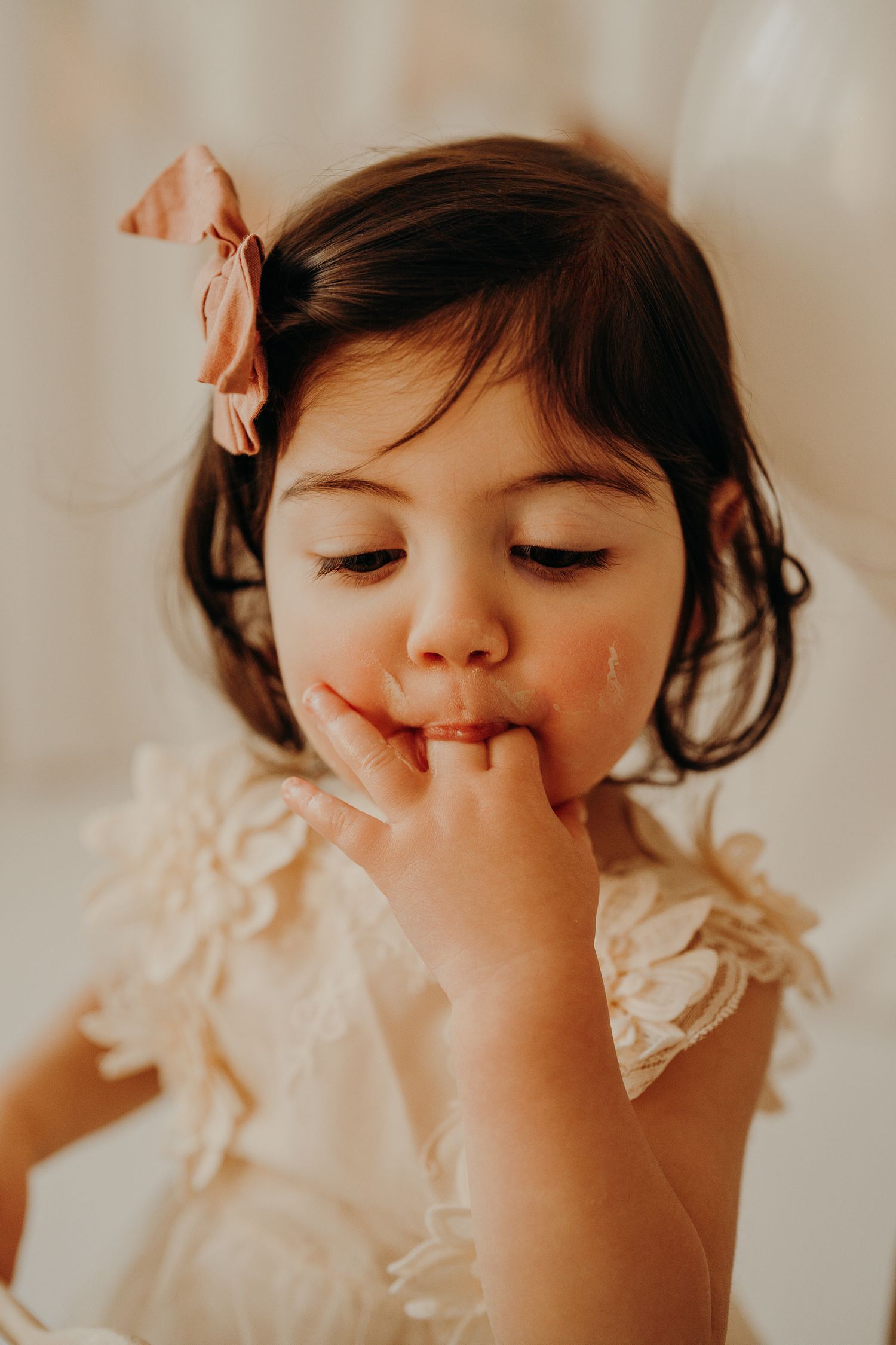 Close-up portrait showing delicate lace details and soft lighting.