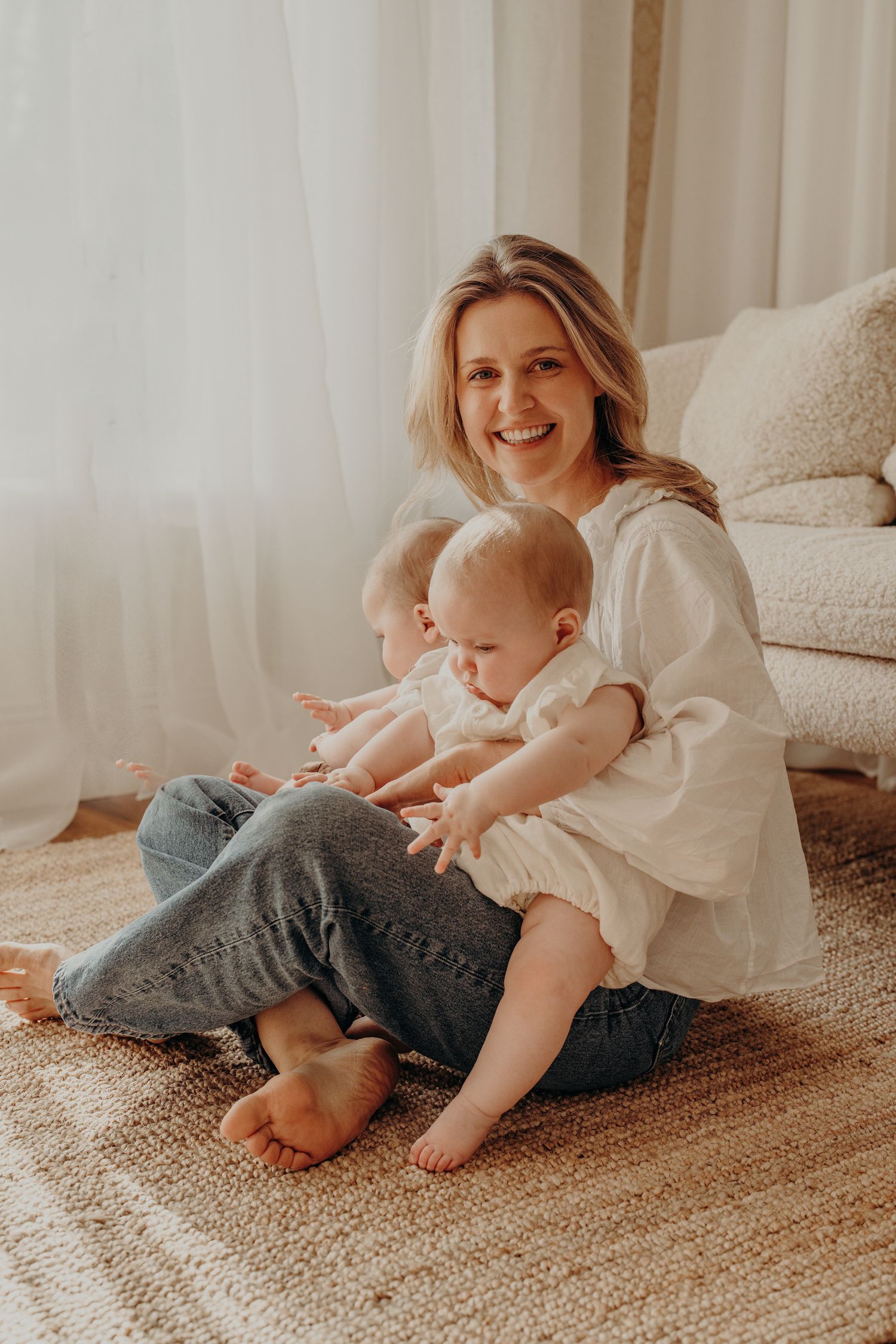 Family relaxing on textured carpet in casual home setting.