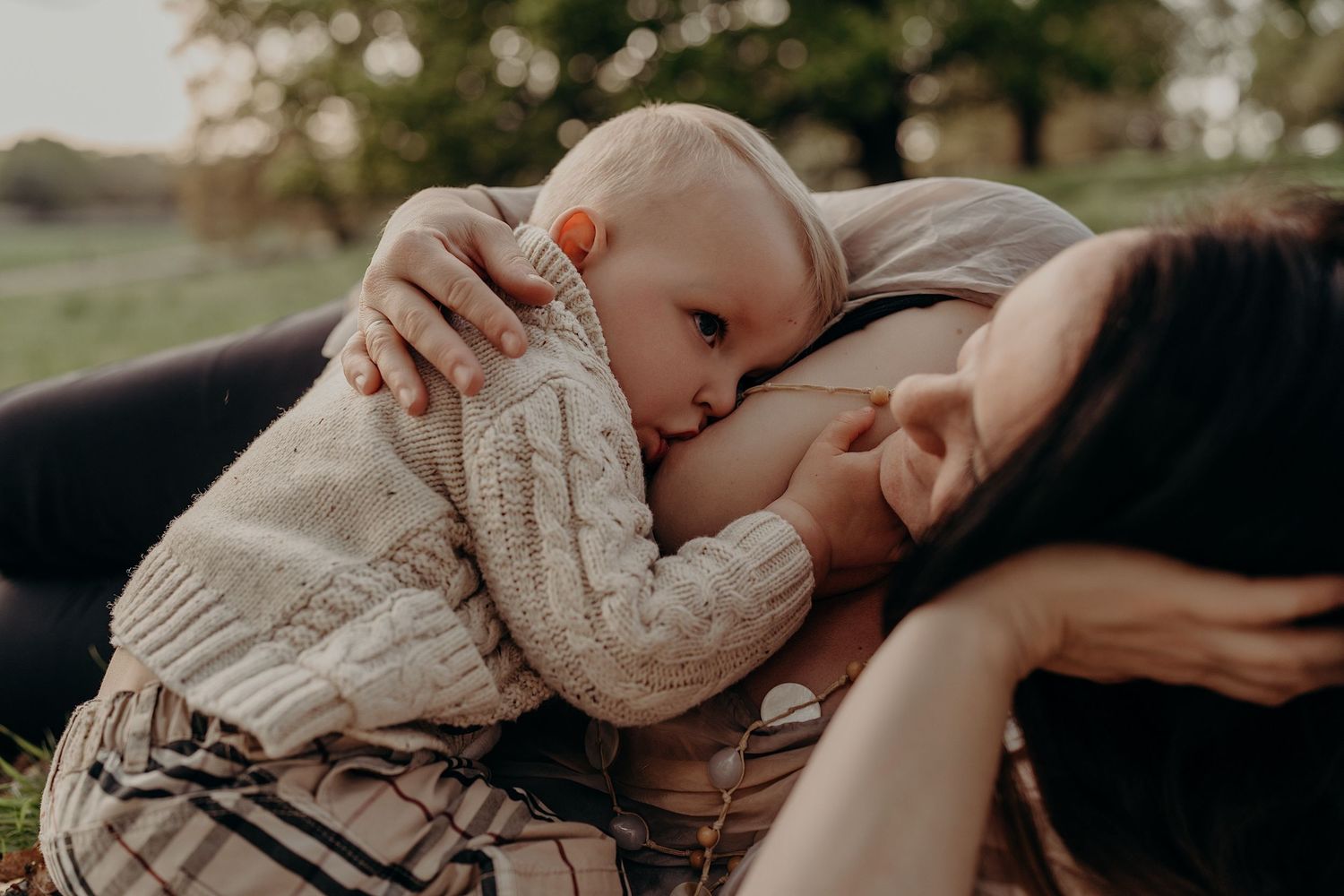 Family sharing intimate moments while relaxing in nature.