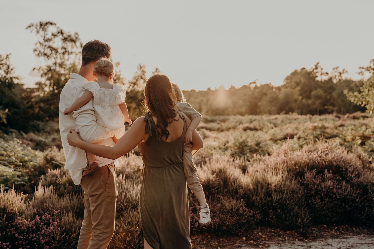 A series of intimate family portraits taken at sunset in a natural outdoor setting.