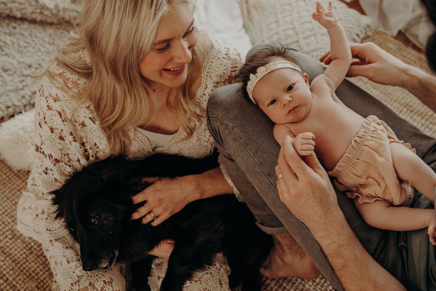 Sweet candid moment with baby on soft textured blanket.