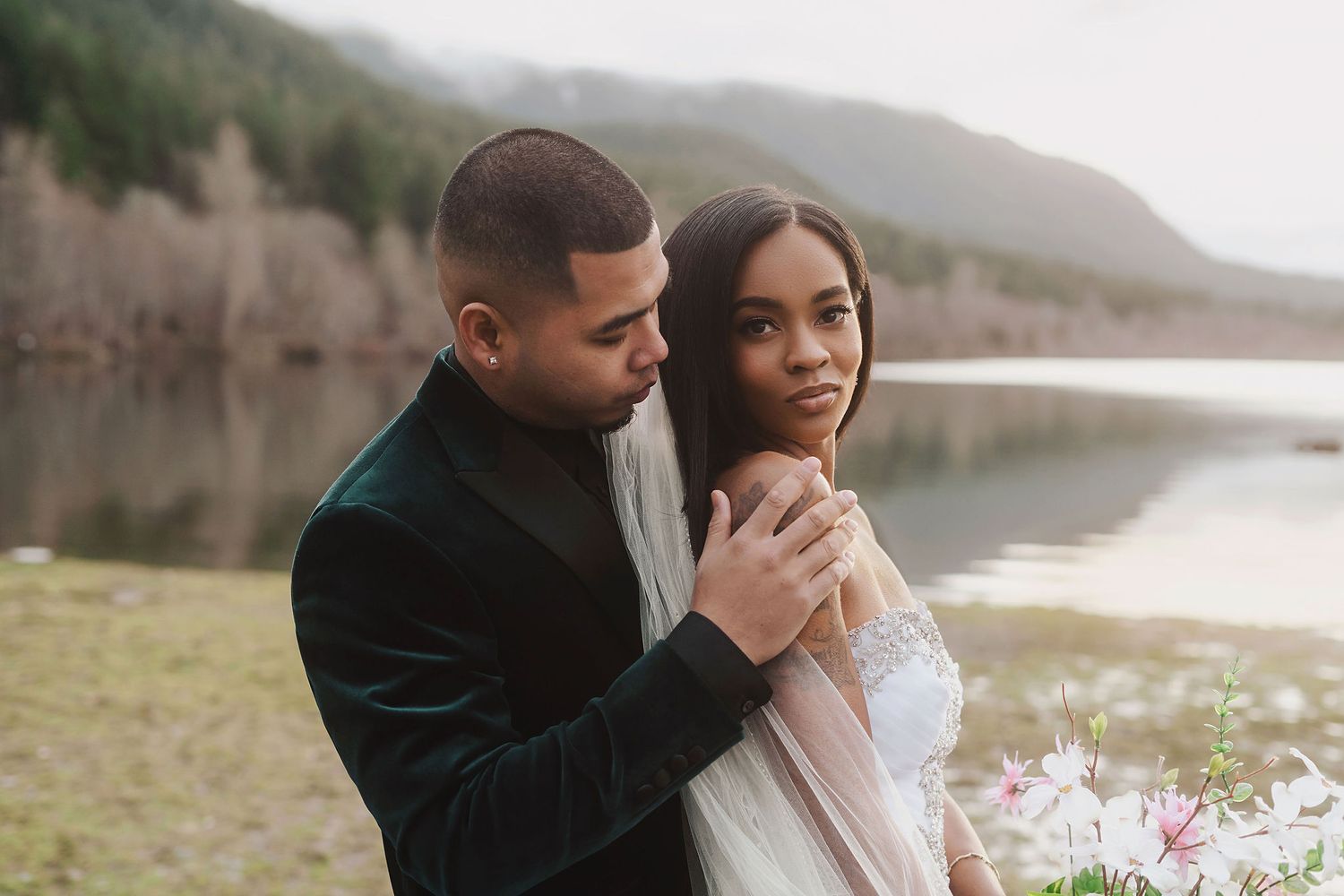 Romantic wedding photos captured against a scenic lakeside backdrop.