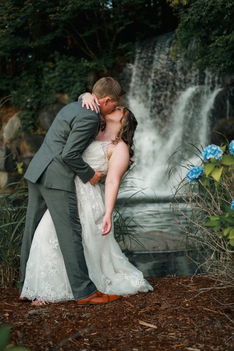 A romantic wedding photo shoot near a cascading waterfall.