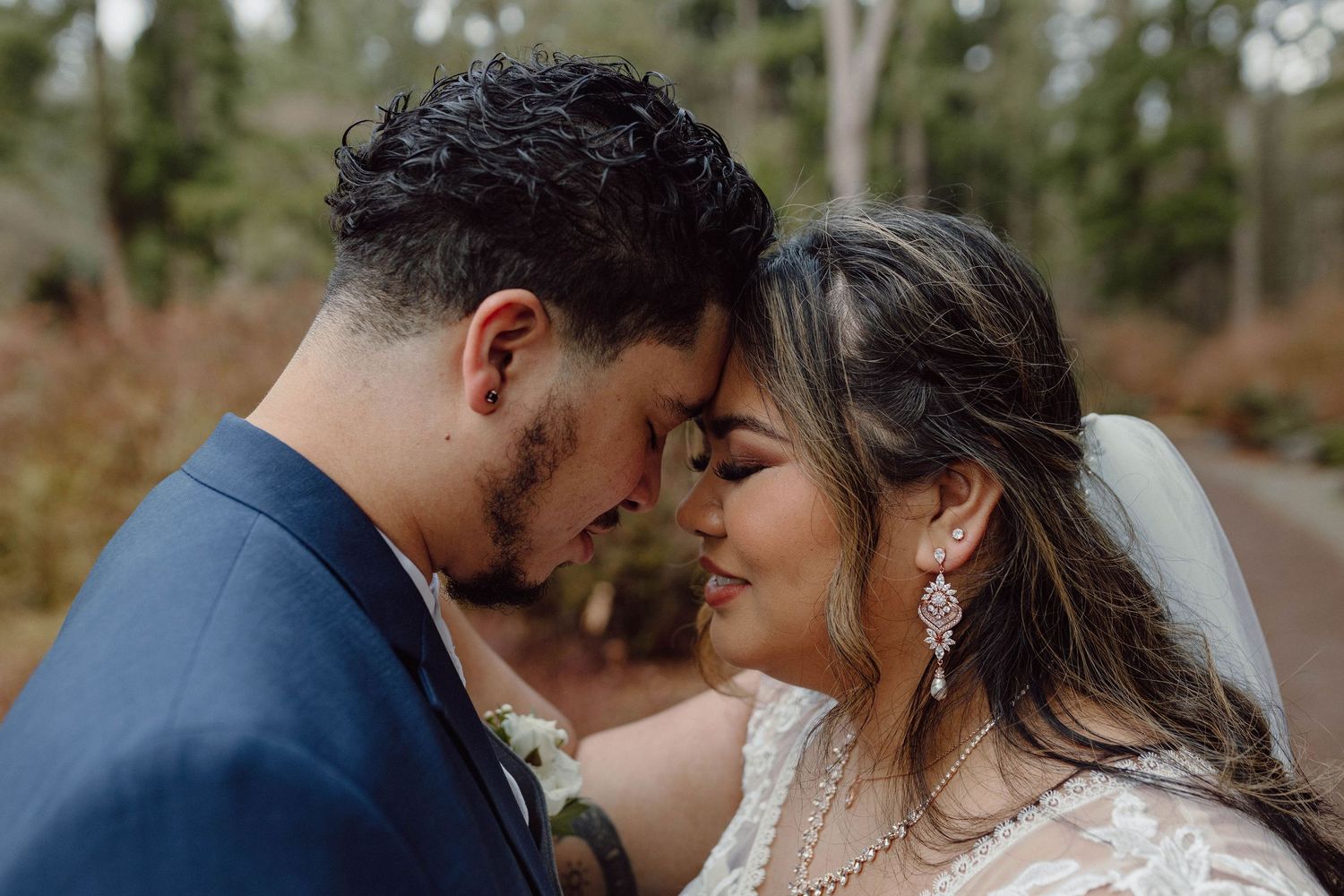 Intimate wedding portraits showing tender moments between newlyweds.