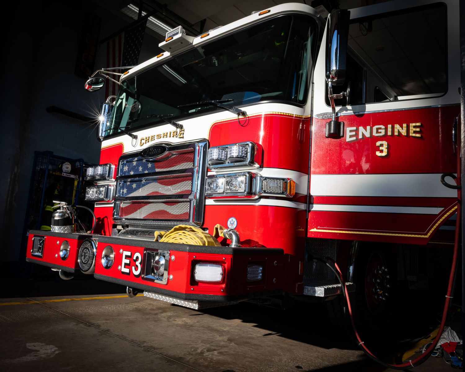 Cheshire Fire Department Engine 3 parked inside a fire station bay.