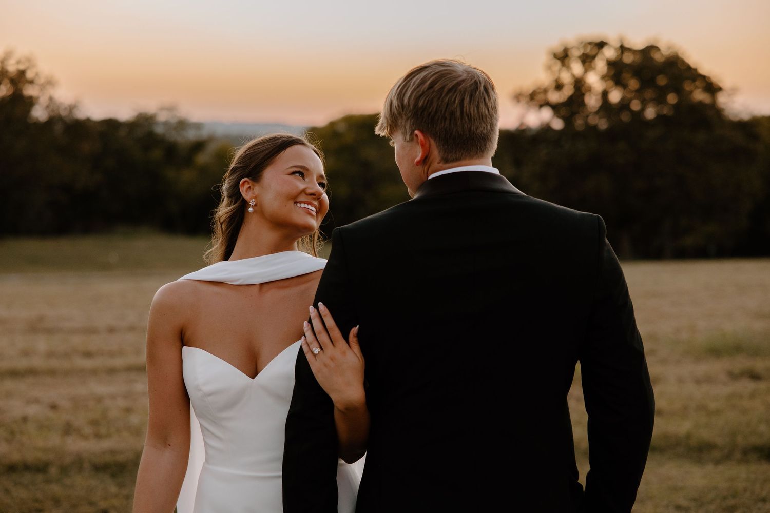Newly married couple from who snuck away from their reception for some dreamy Oklahoma sunset photos.