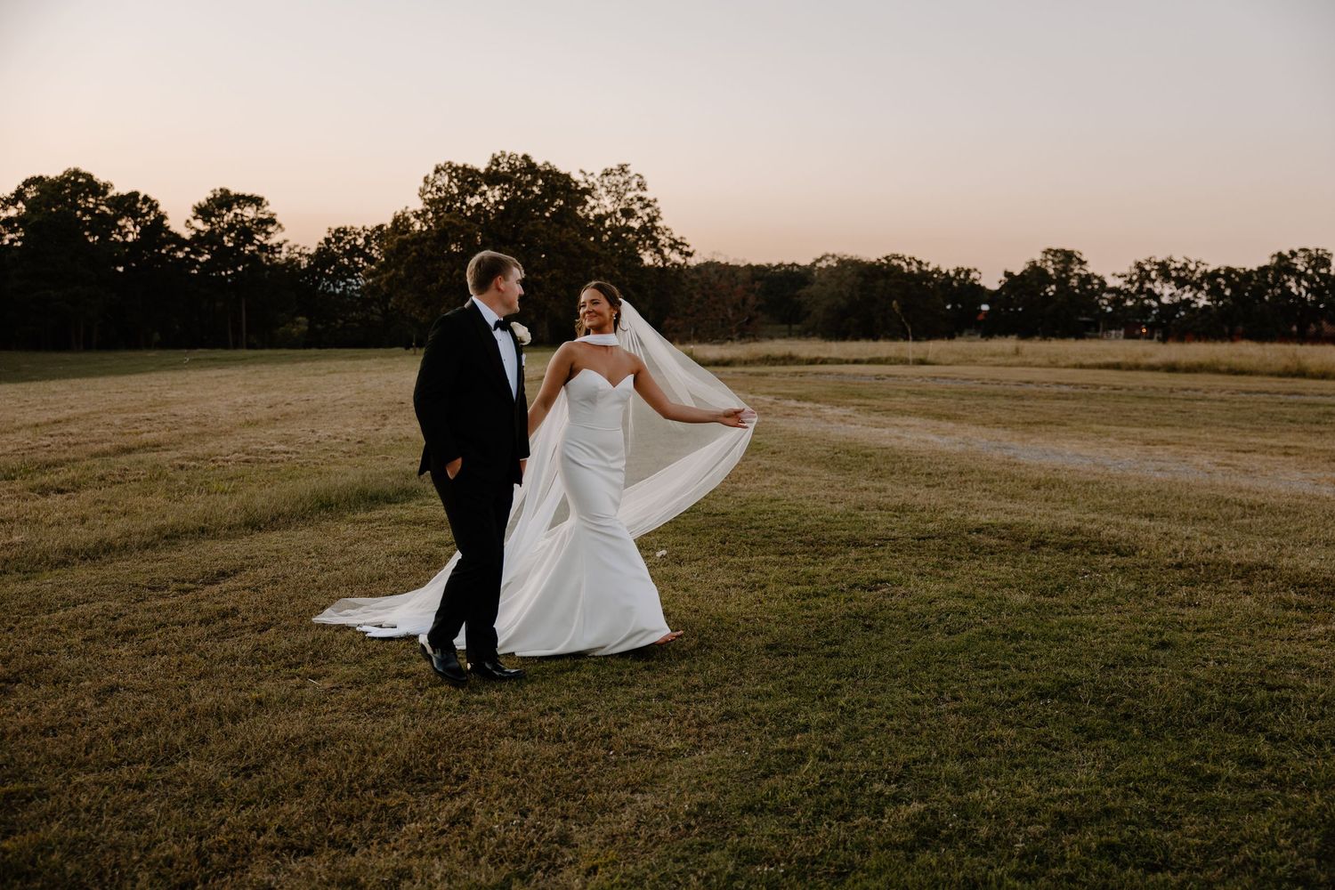 Newly married couple who snuck away from their reception for some dreamy Oklahoma sunset photos.