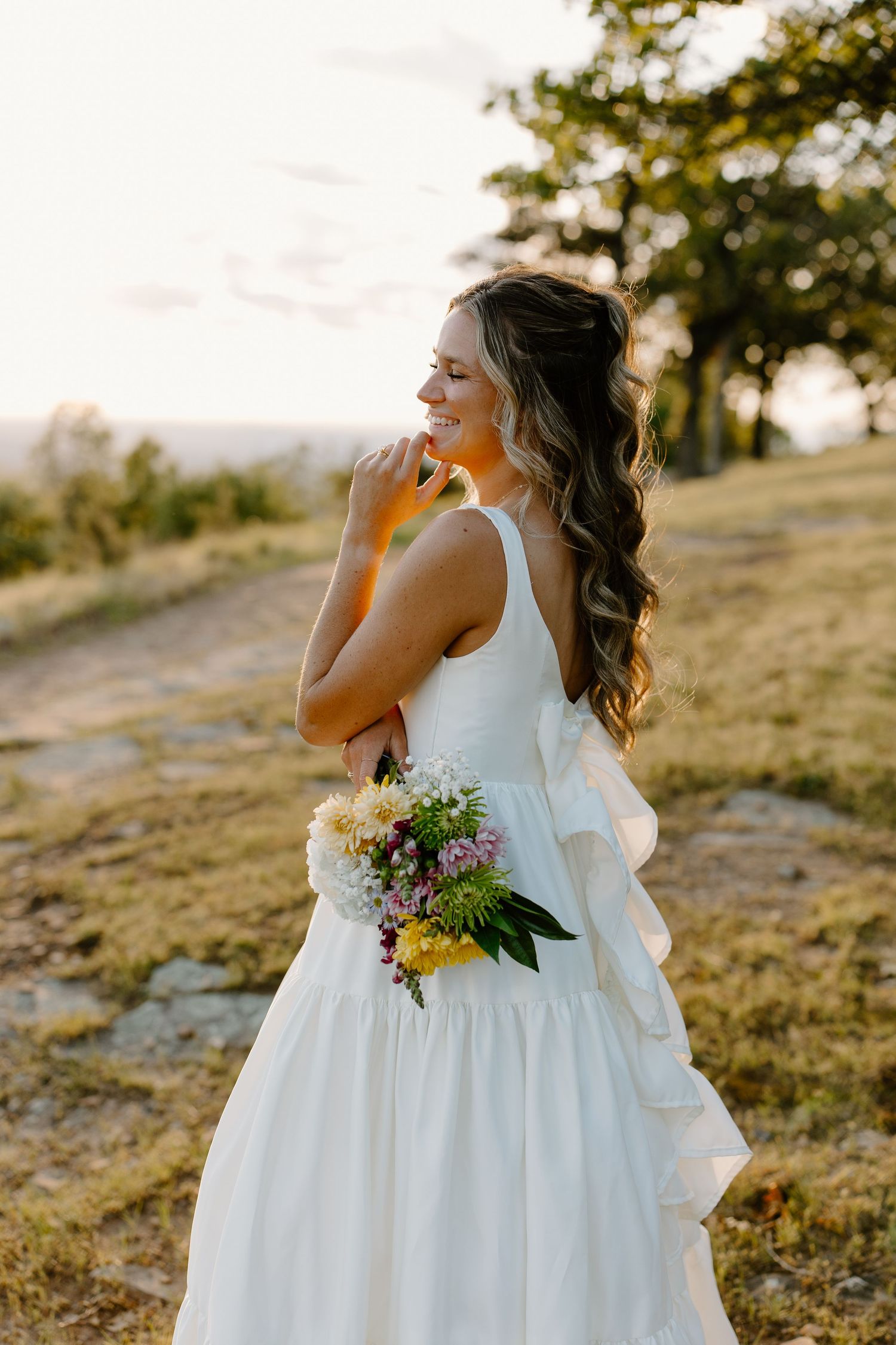 Bridal photos taken right before her spring adventure elopement at Mount Nebo State Park in Arkansas.