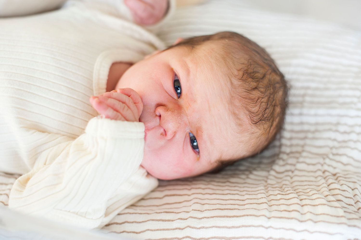 Close up portrait of newborn baby in hospital.