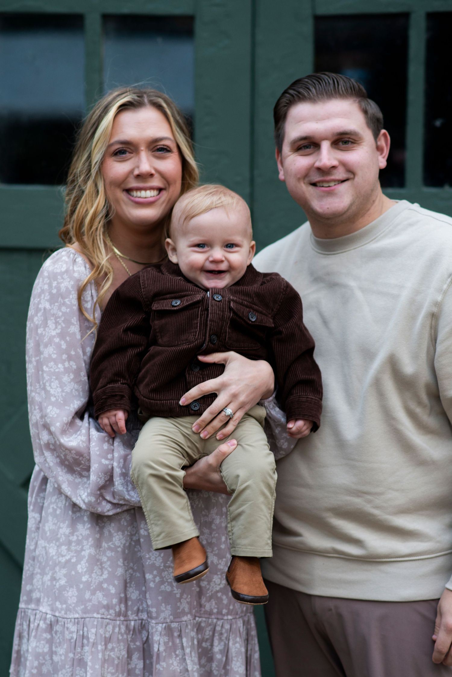 Family smiling at camera. Outdoor mini session portrait in Cherry Hill, NJ.