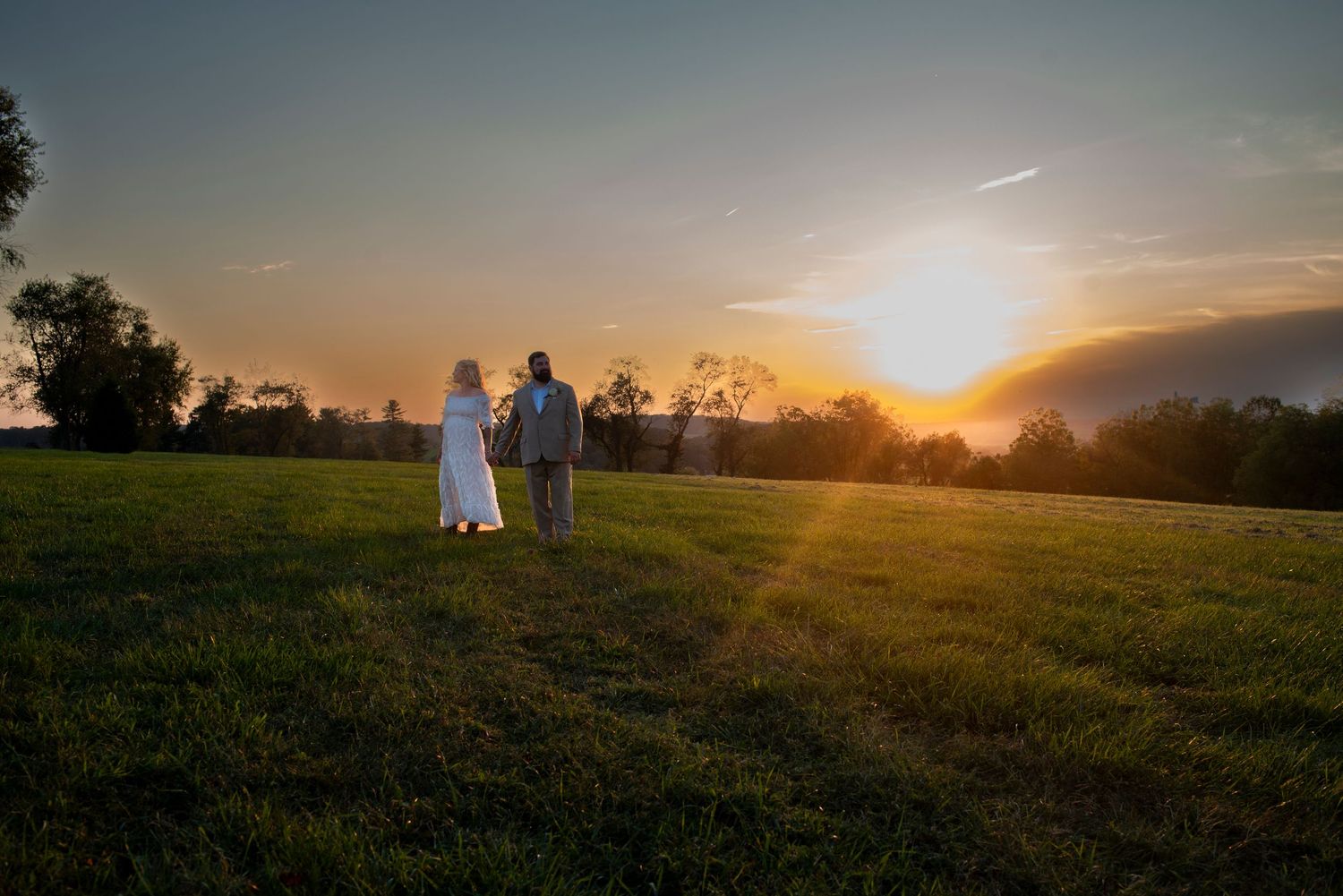Landscape portrait of bride and groom at sunset during wedding reception in Coatesville, PA.
