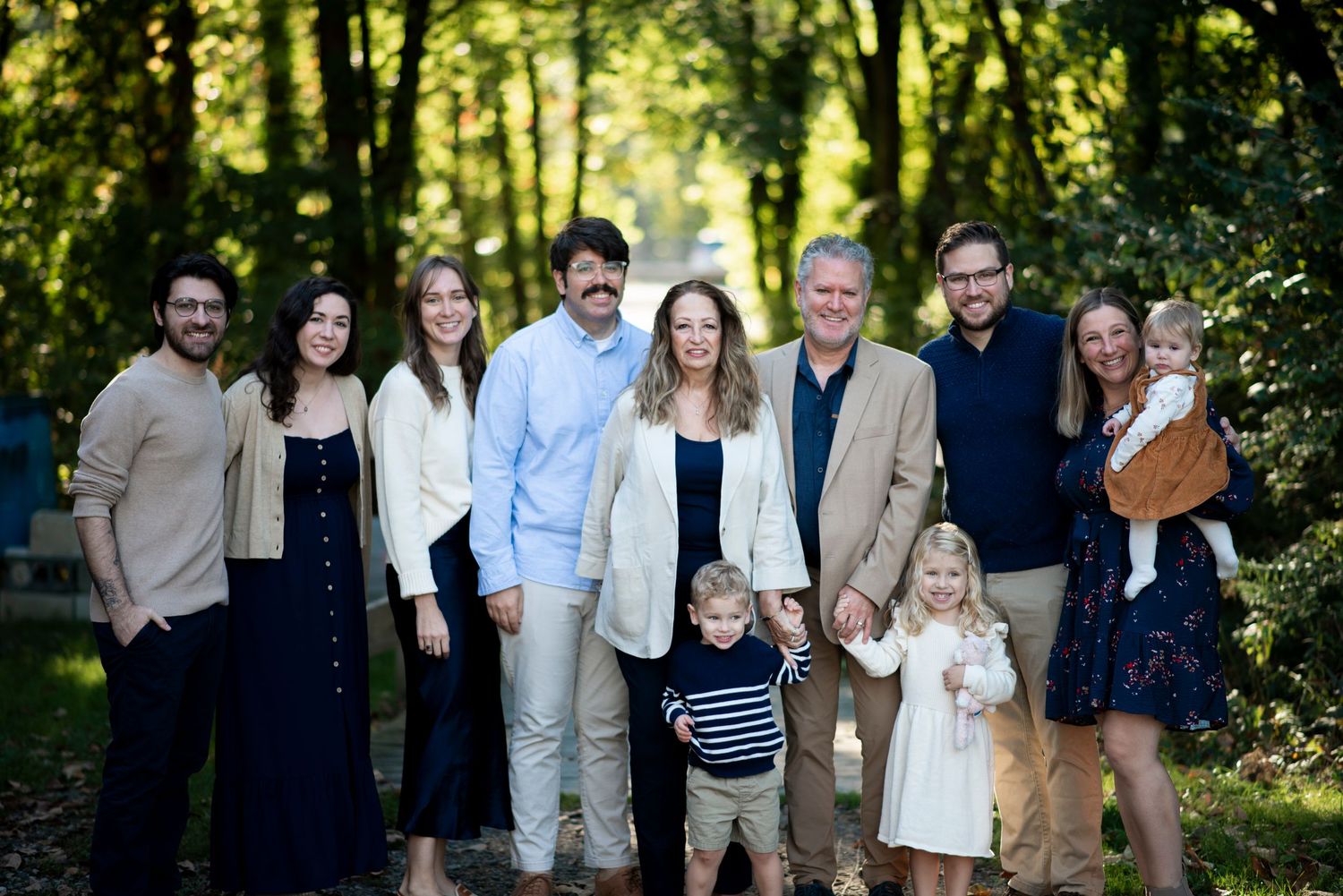 Extended family portrait of parents with their adult children and grandchildren at Croft Farm in Cherry Hill, NJ.