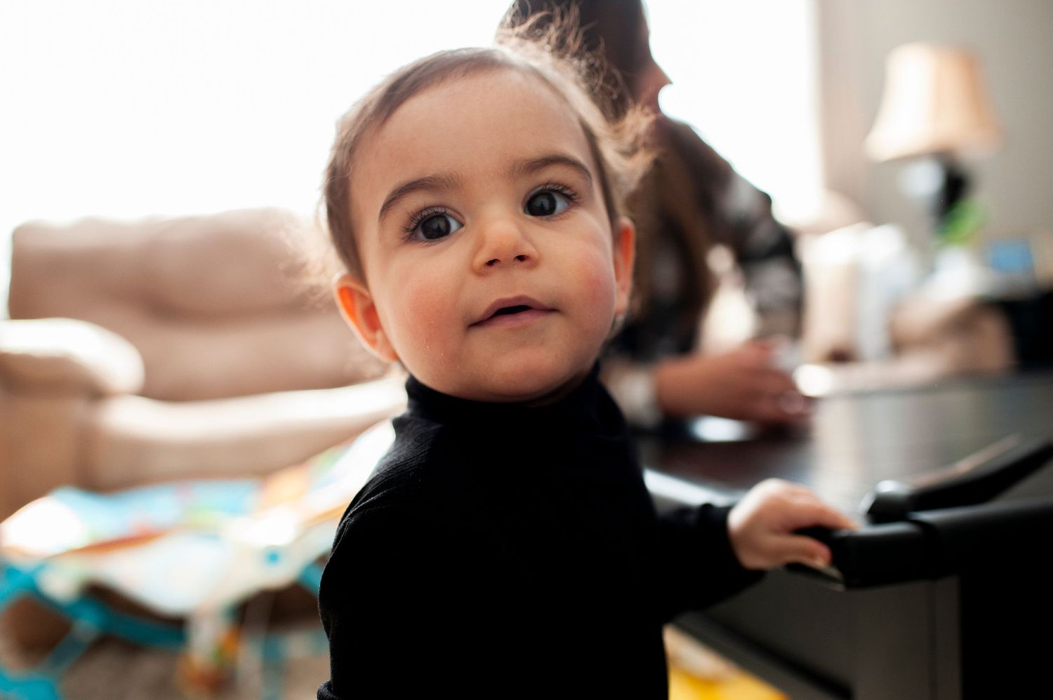 Toddler smiles for the camera at home in Cherry Hill, NJ.