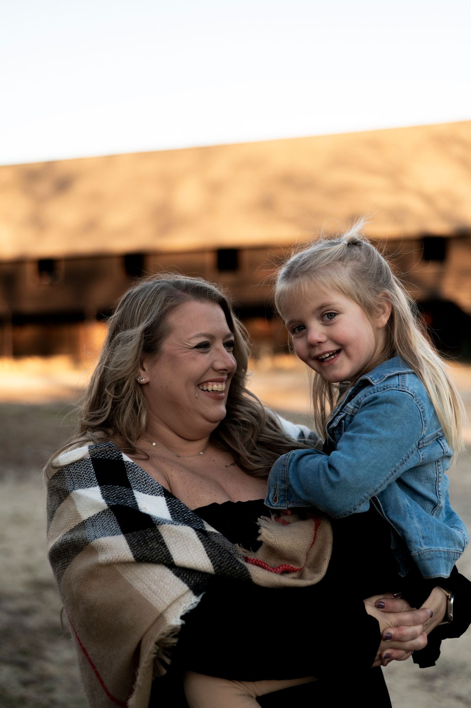 Mother and daughter laugh together at Batsto Historic Village in New Jersey.