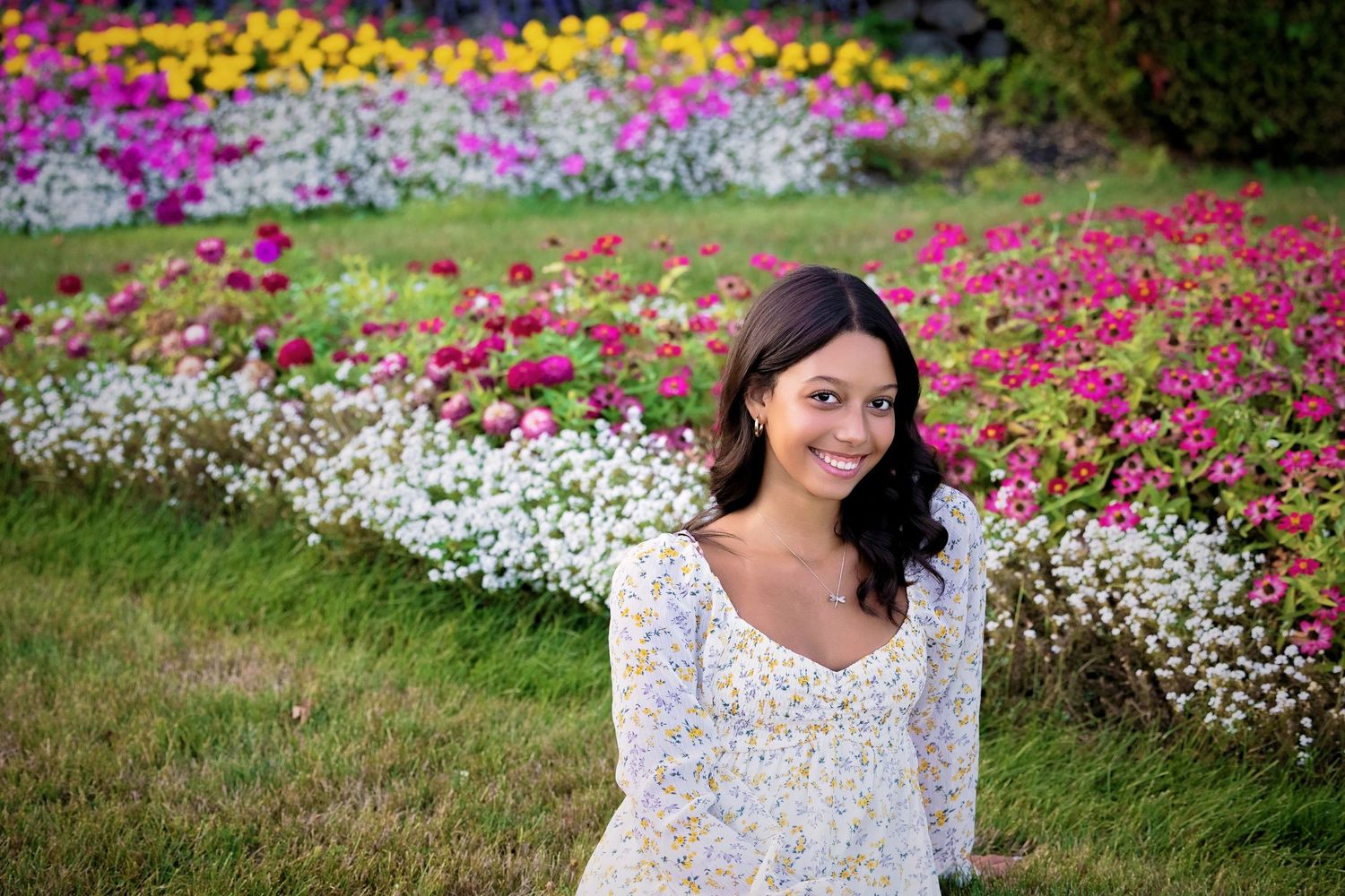 Garden photoshoot featuring bright pink and white flowers in bloom.