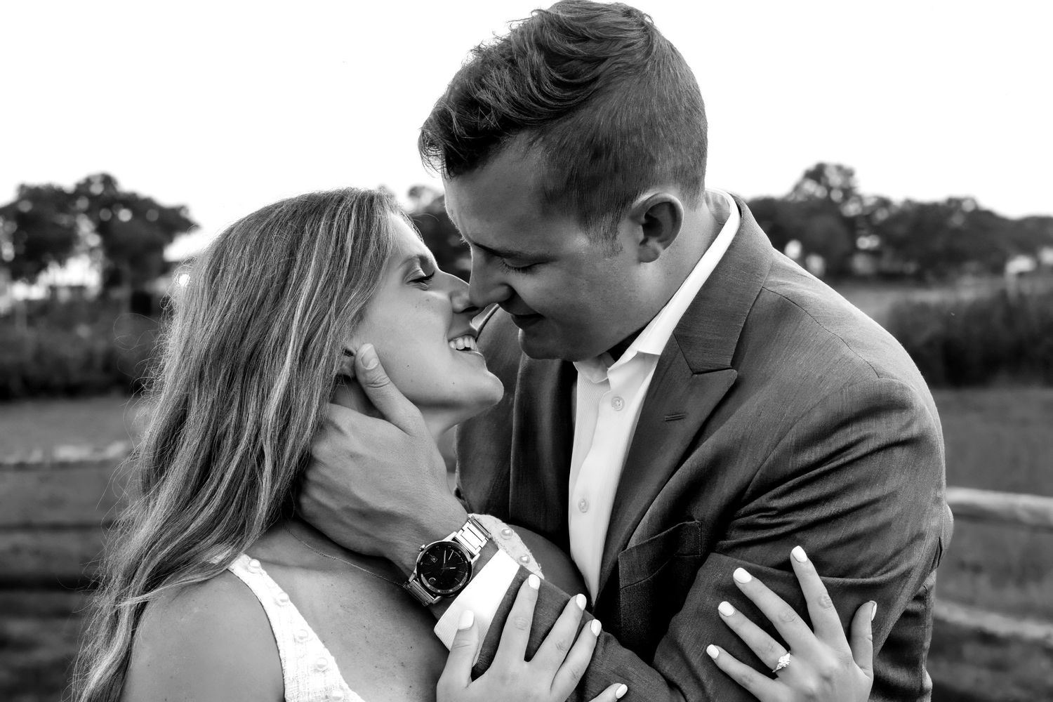 Romantic couple sharing intimate moments in outdoor photo sequence.