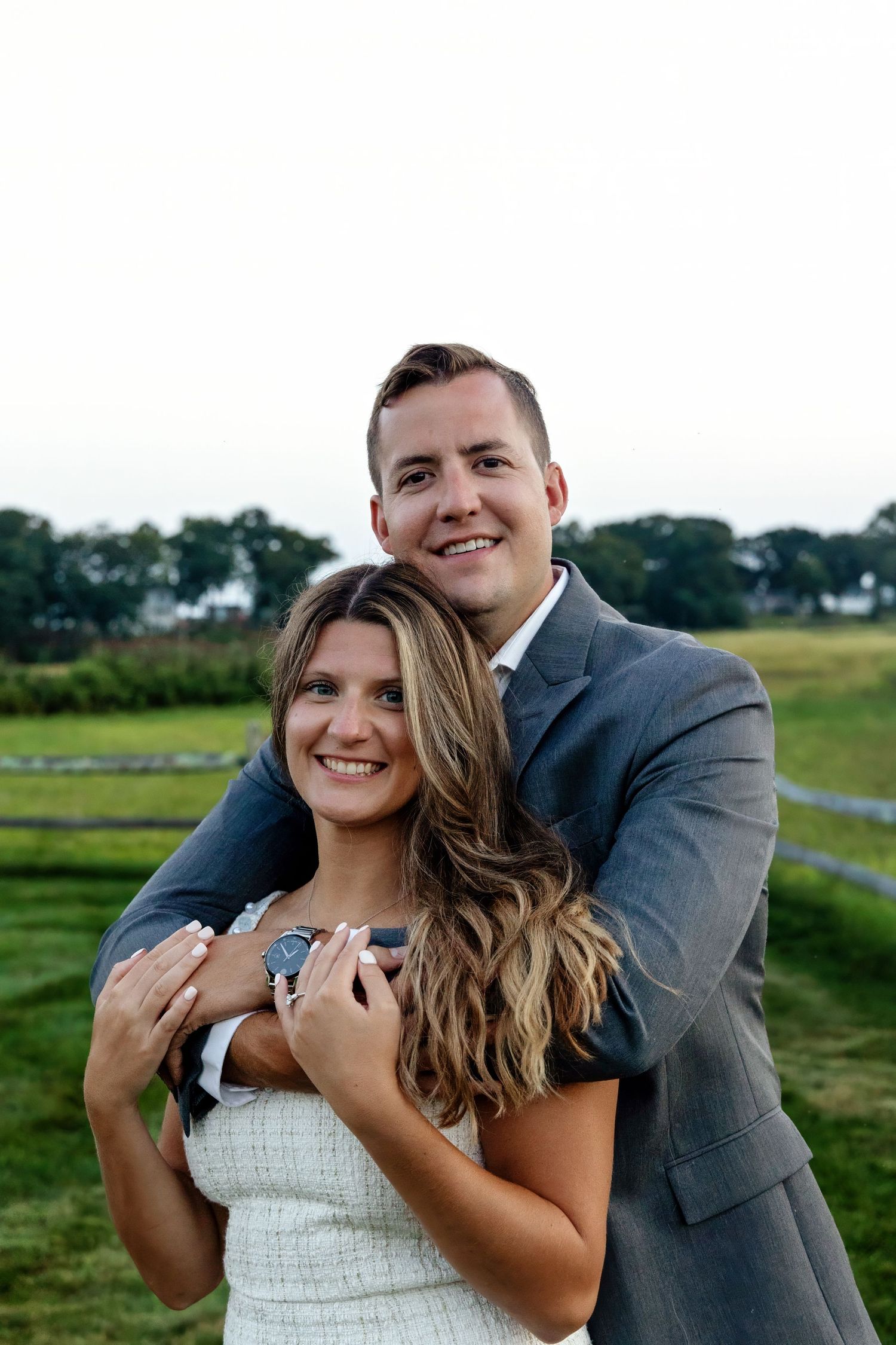 Happy couple sharing playful moments during outdoor photo session.