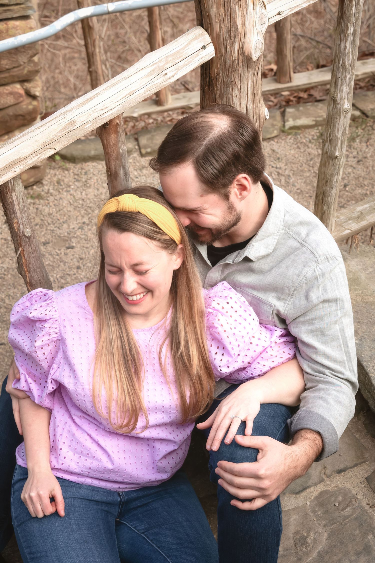 A couple sharing a candid laughing moment together in a series of four connected photos.