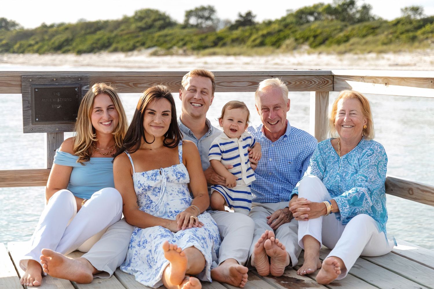 Multi-panel photo of a family in coordinating blue and white outfits relaxing together on a beach dock.