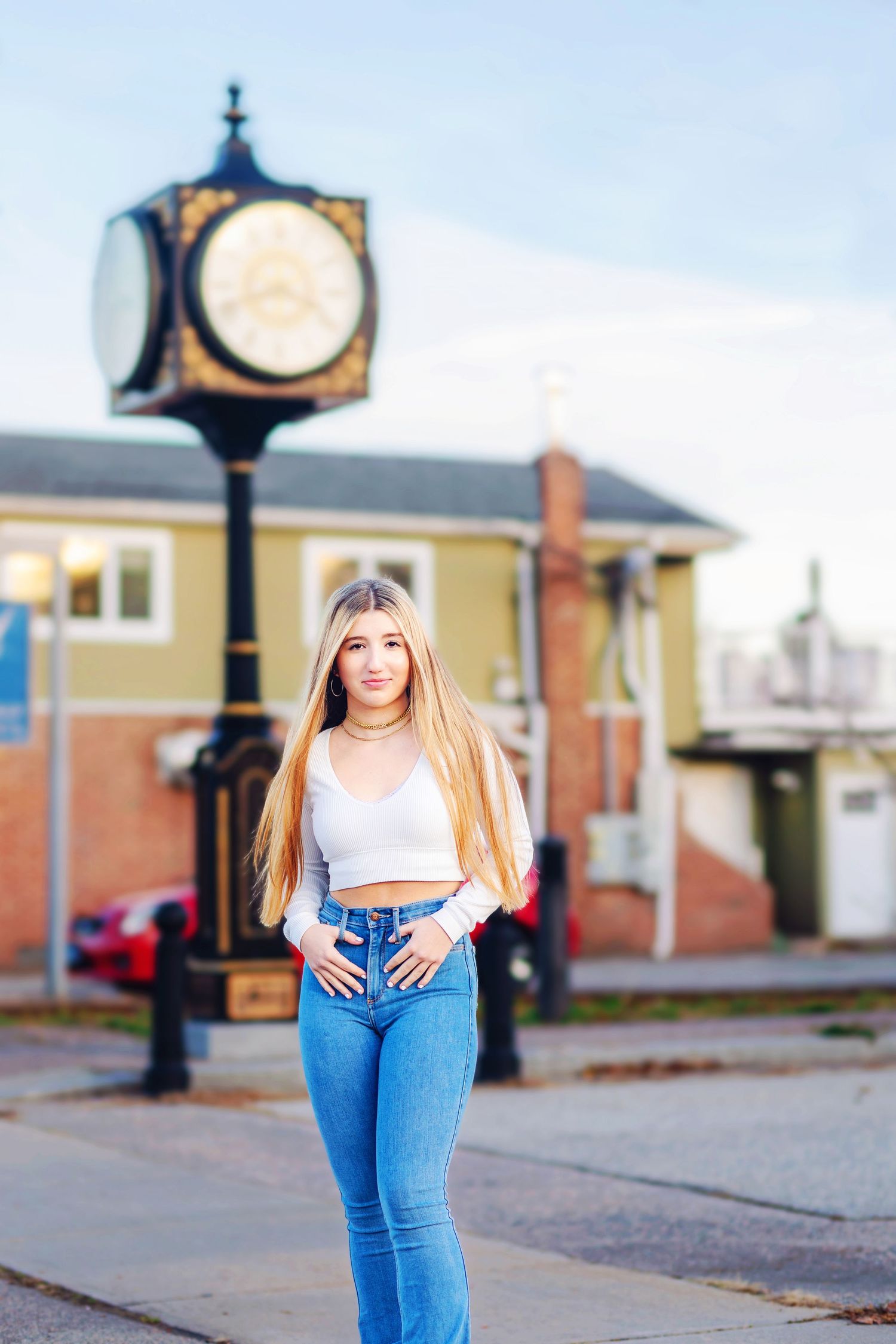 A series of four connected photos showing a person in blue jeans and white top standing near a vintage street clock.