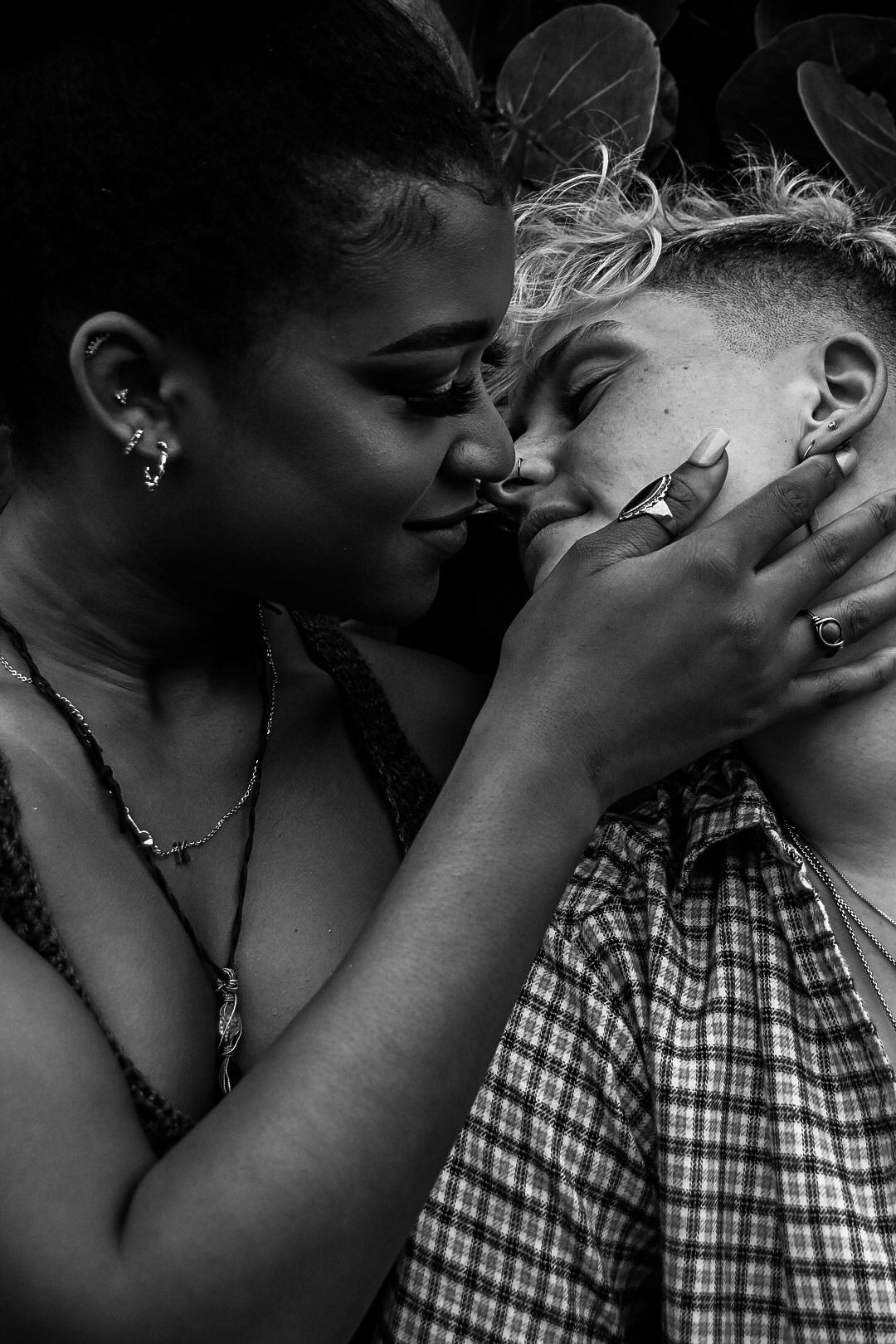 Black and white sequence of romantic close-up shots showing an intimate moment between two people.