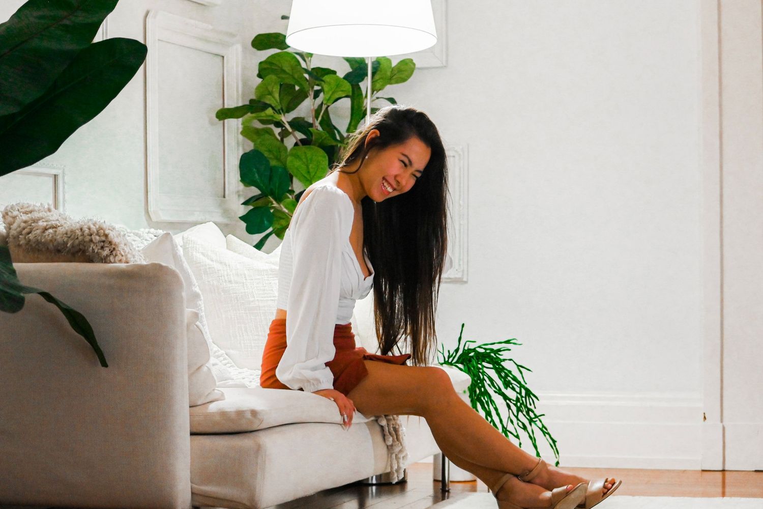 Series of interior boudoir photos in bright sunlit room with plants and white decor.