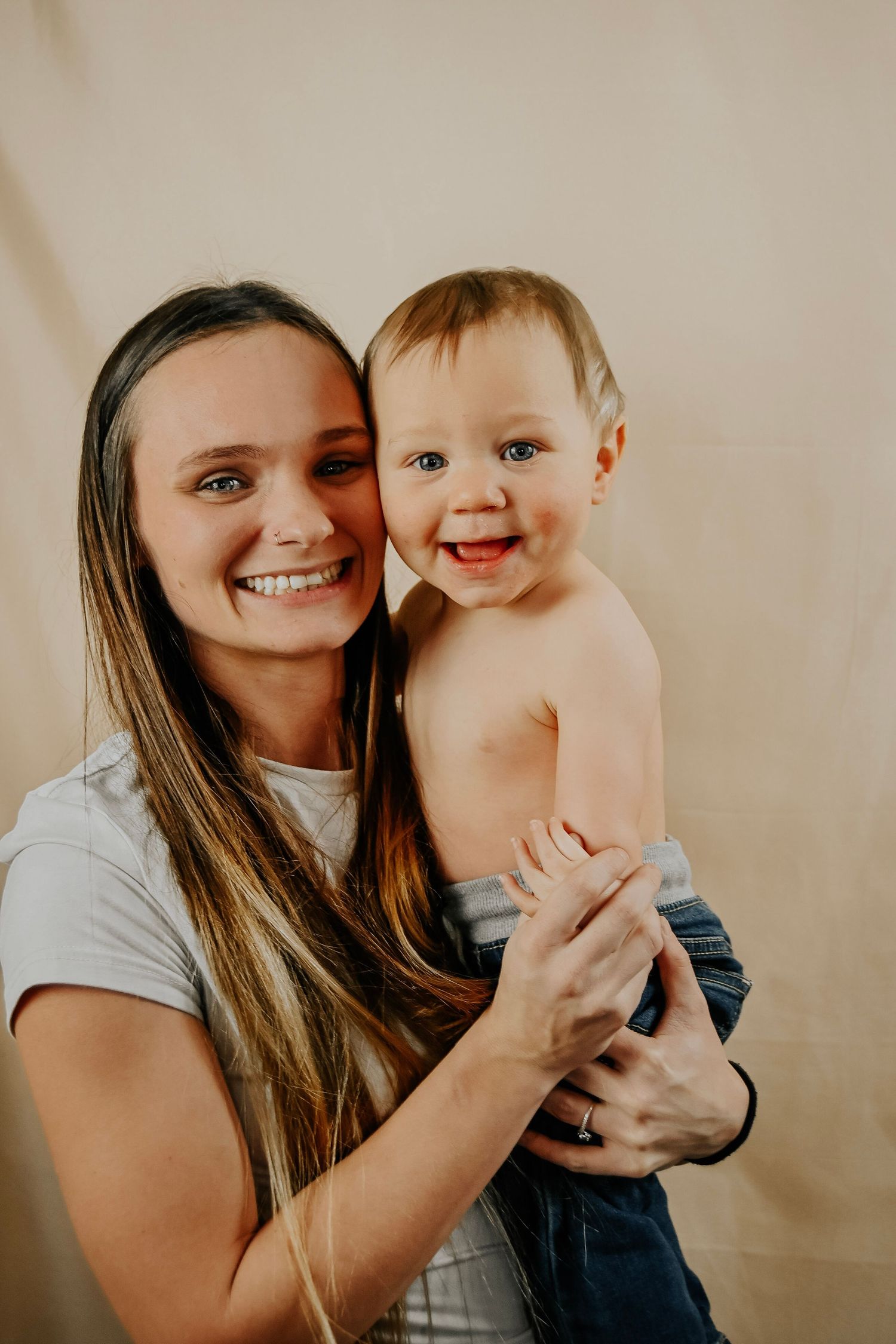 A series of warm-toned studio portraits showing joyful moments between parent and child against a neutral background.