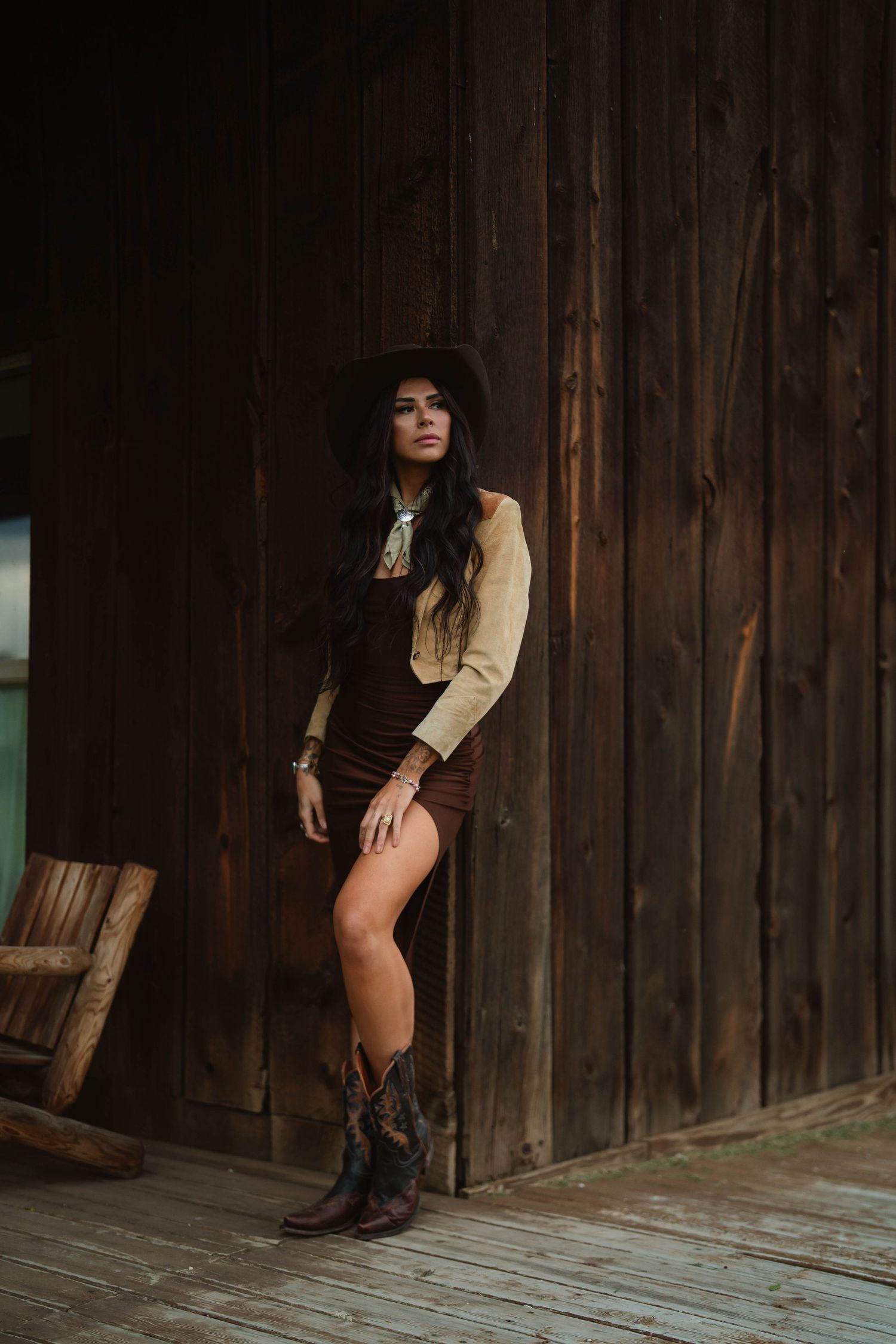 Rustic fashion shoot on a wooden porch of an old barn.