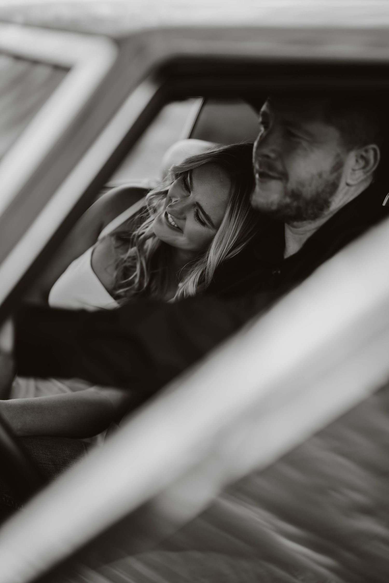 Black and white intimate portraits taken inside vintage car.