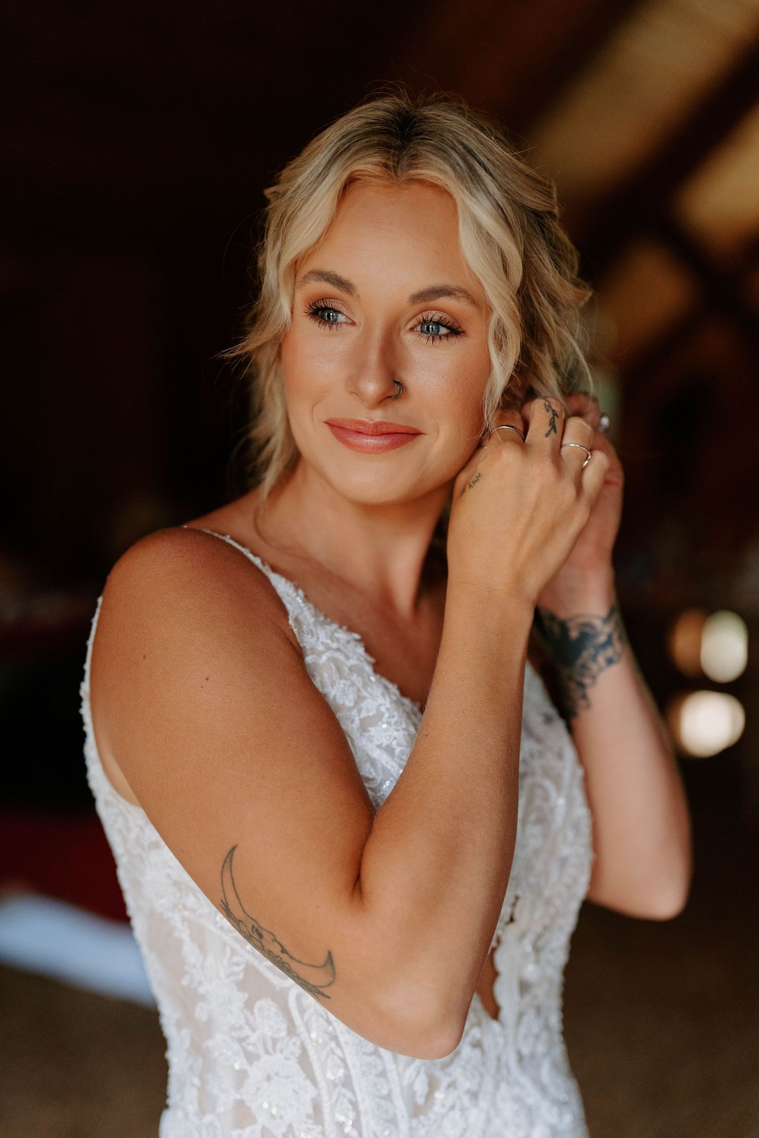 Close-up portrait shots of a bride in a white lace wedding dress showing joyful expressions.