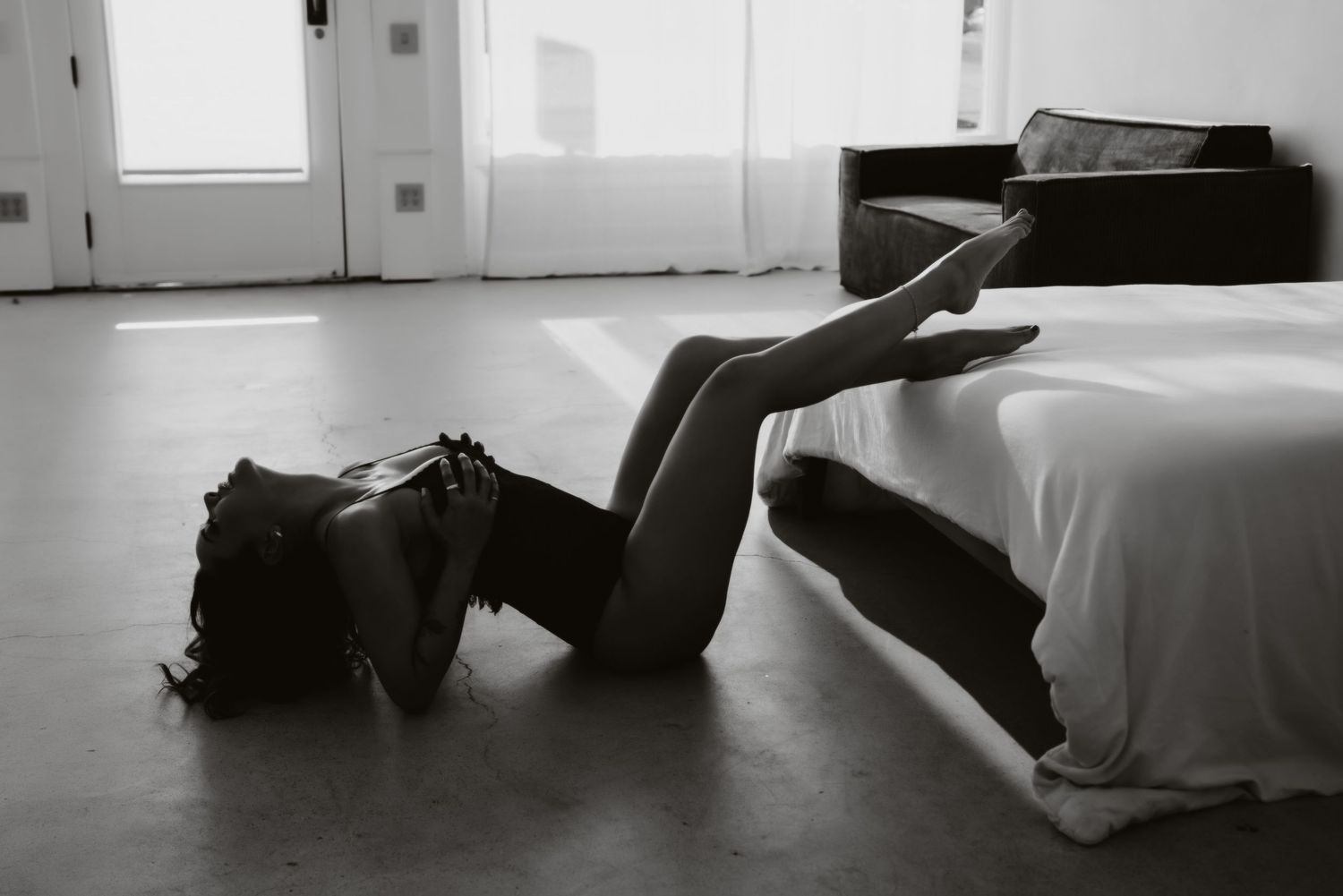 Minimalist black and white photo series showing a figure in various poses against a stark white background.