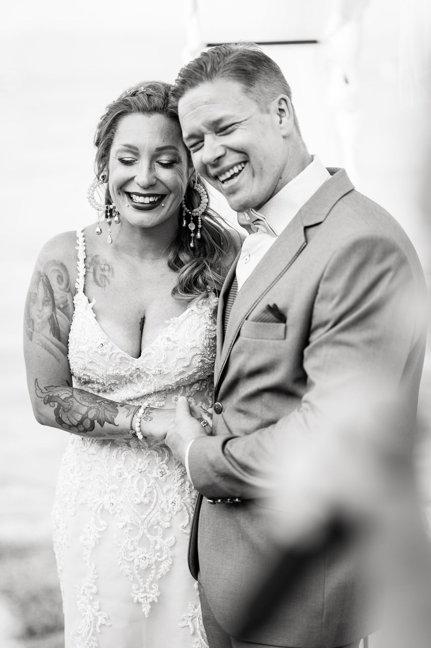 Romantic black and white sequence of candid wedding moments filled with laughter.