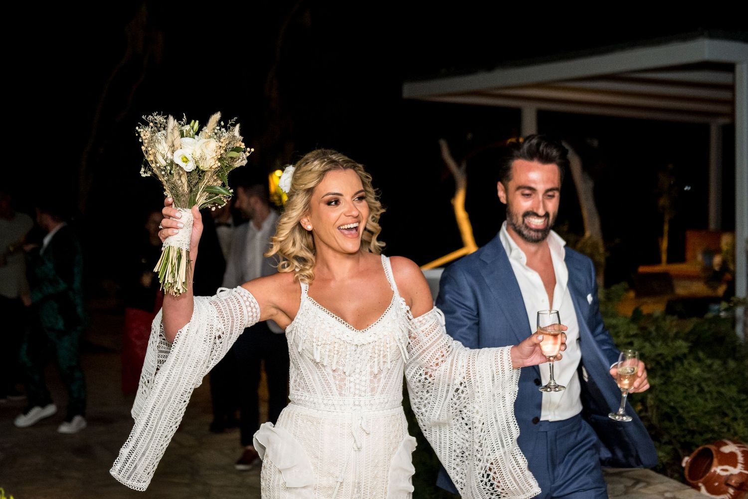 Bride and groom share romantic dance moves during wedding reception.