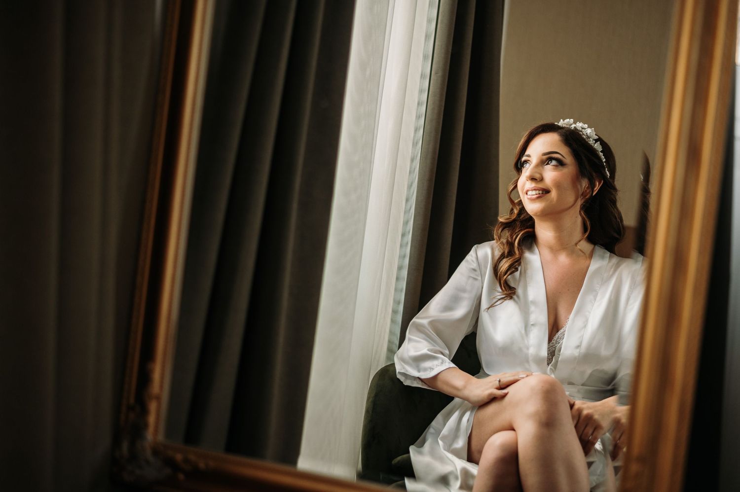 Elegant bridal preparation moments captured in natural window light.