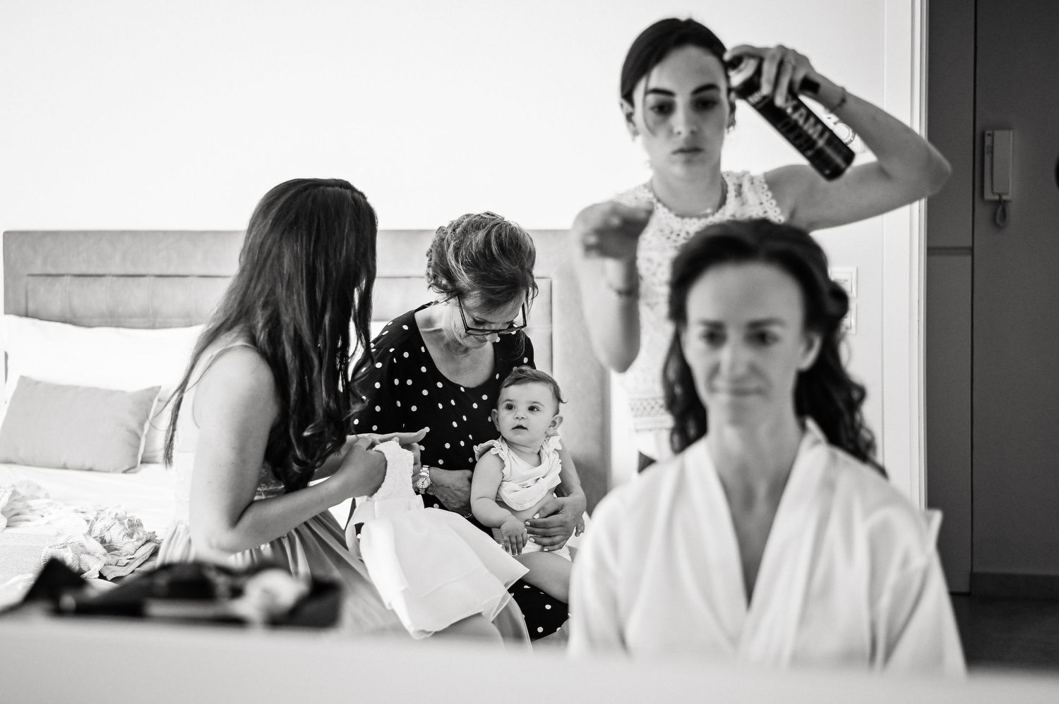 Black and white getting ready shots of wedding morning preparations.
