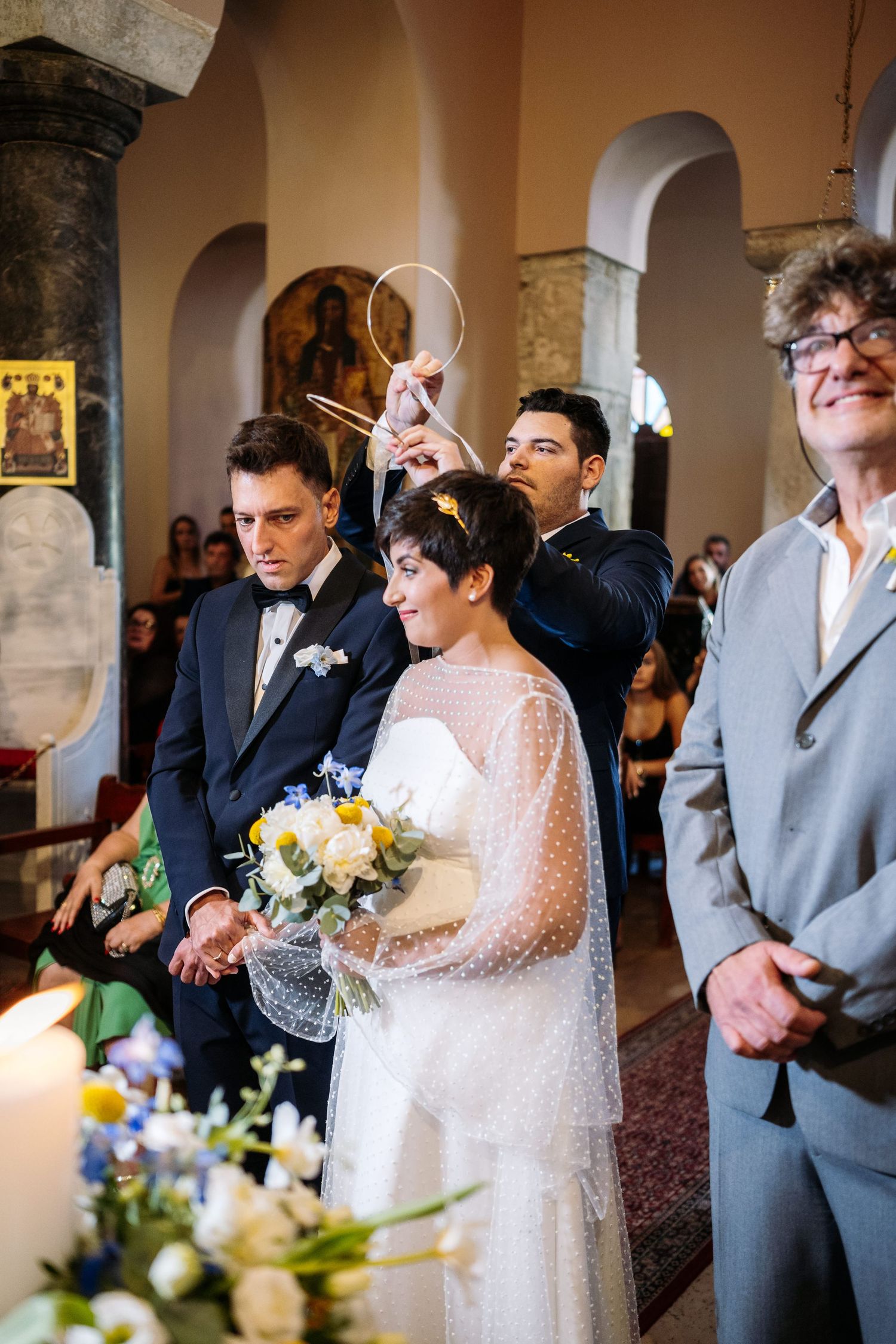 Traditional church wedding ceremony with elegant floral arrangements and formal attire.