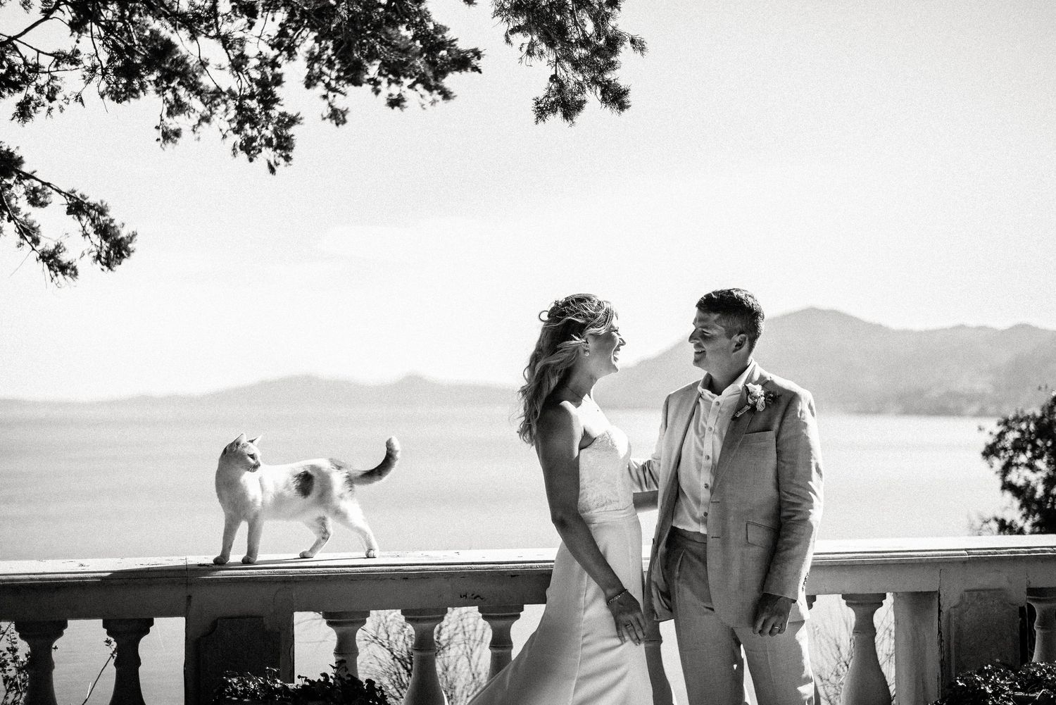 Black and white wedding photos captured against a scenic mountain backdrop.