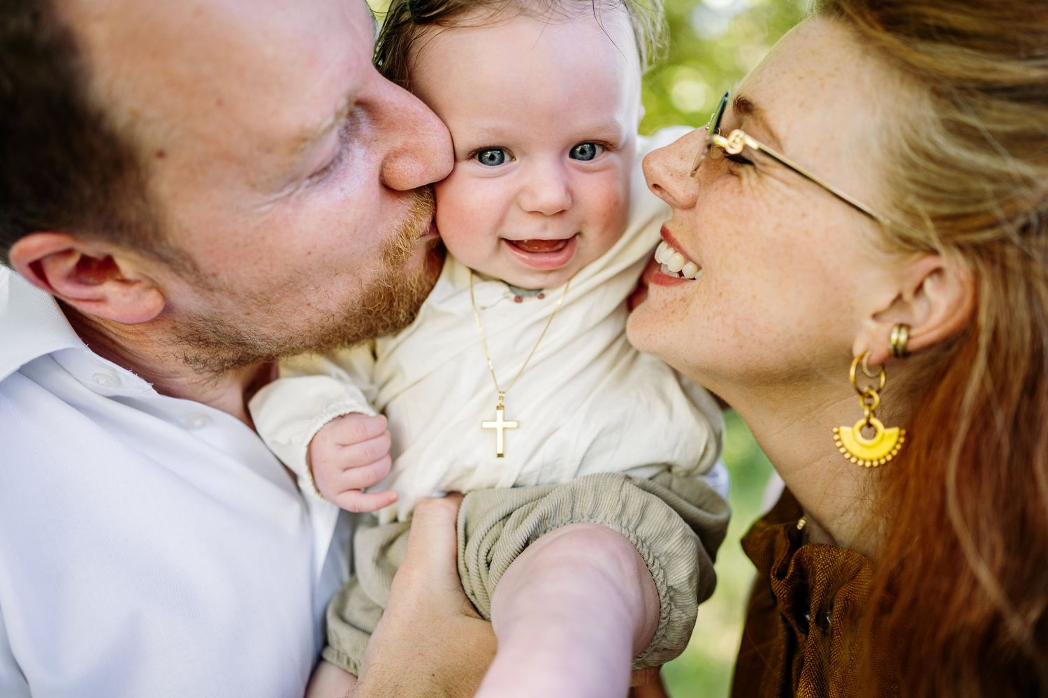 Tender family moment captured outdoors in natural light.