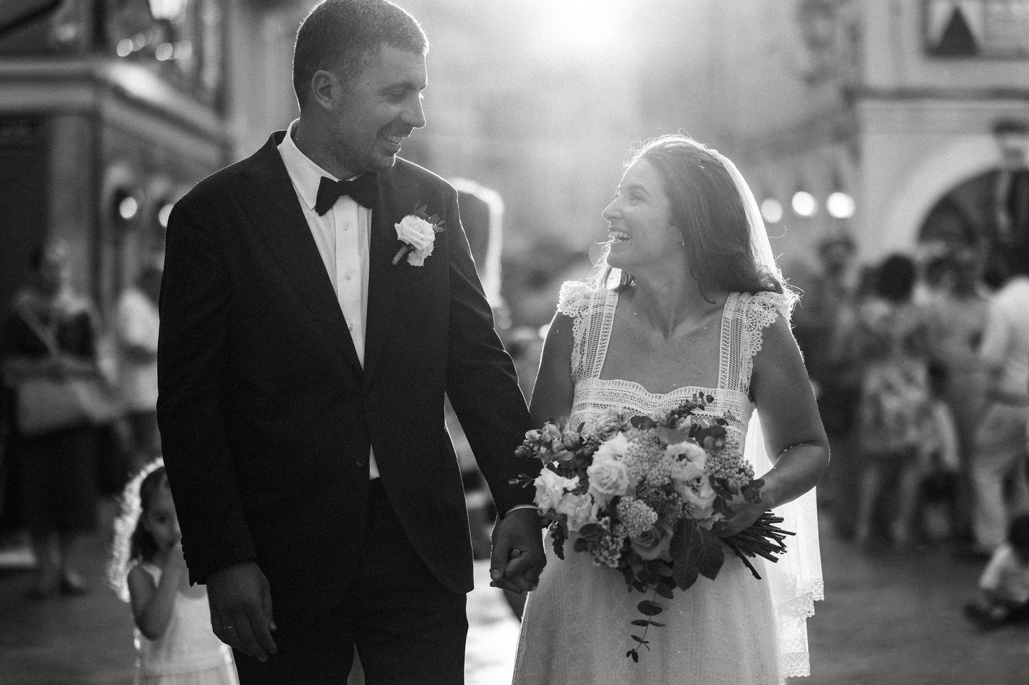 A romantic black and white wedding photo on a charming European street.